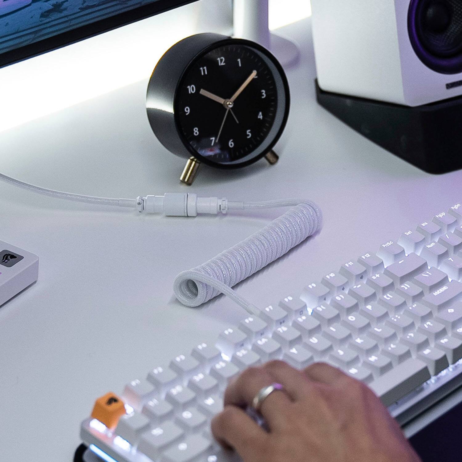 The text on the image is a keyboard layout, which shows the position of the keys on a keyboard. The layout is as follows:

1 2 3 4 5 6 7 8 9 0 - = + < > . /

F1 F2 F3 F4 F5 F6 F7 F8 F9 F10 F11 F12

Shift 1 Shift 2 Shift 3 Shift 4 Shift 5 Shift 6 Shift 7 Shift 8 Shift 9 Shift 0

Ctrl Ctrl Alt Grn Sysrq

The person in the image is using the keyboard, likely typing or navigating through the computer.