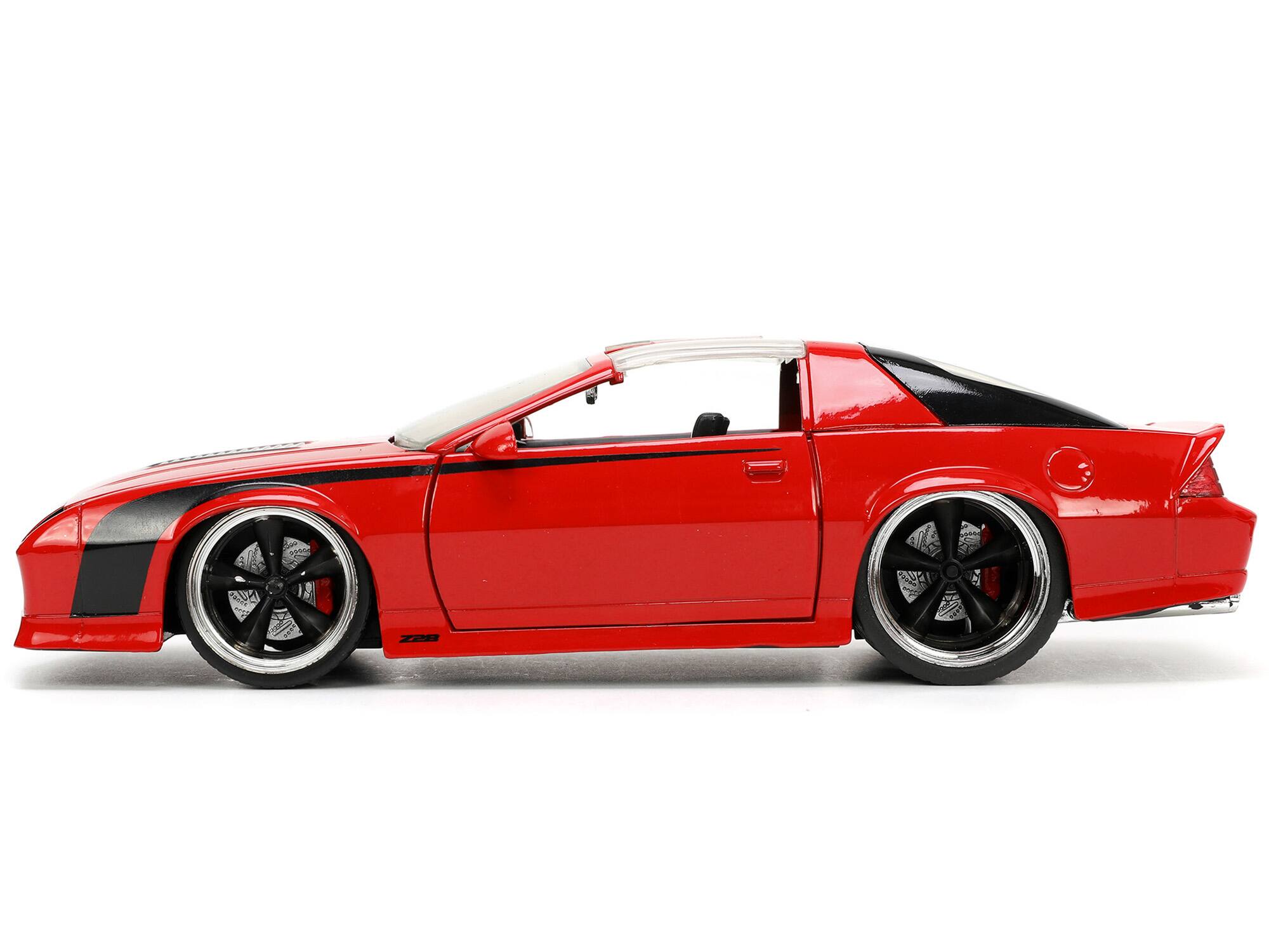 Left. Jada - 1985 Chevrolet Camaro Red with Black Stripes "Bigtime Muscle" Series 1/24 Diecast Model Car by Jada - Red And Black.