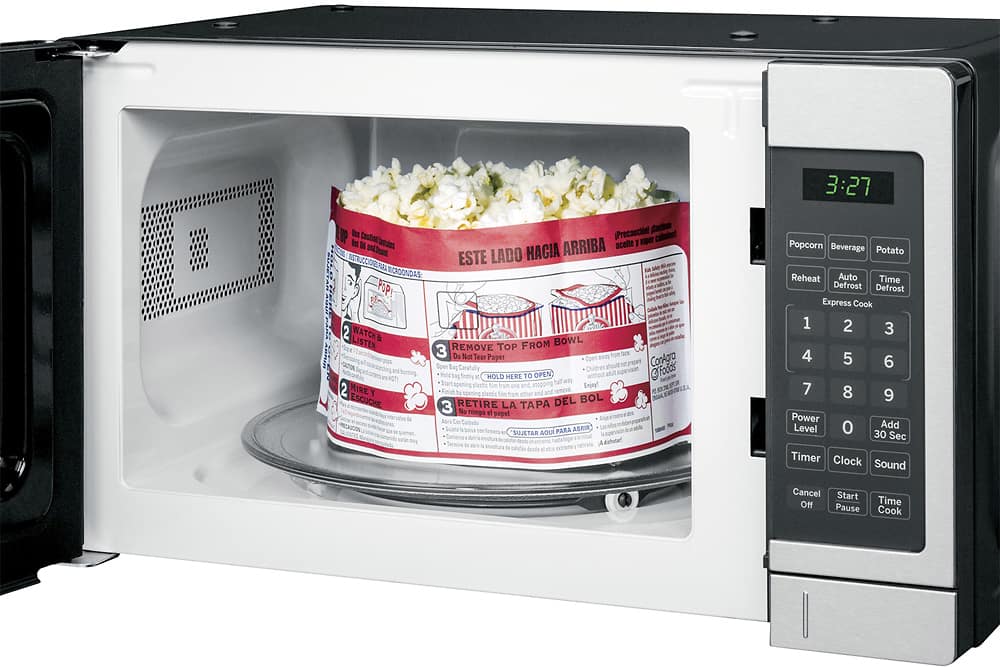 Left. GE - 0.7 Cu. Ft. Compact Microwave - Stainless Steel.