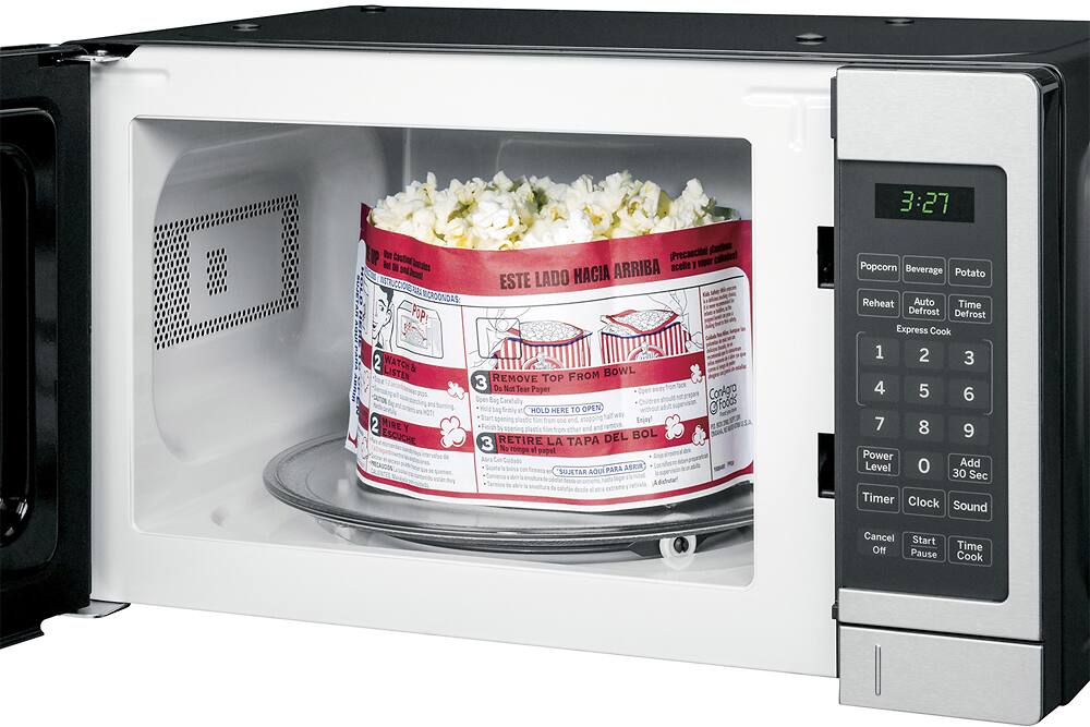 Left. GE - 0.7 Cu. Ft. Compact Microwave - Stainless Steel.