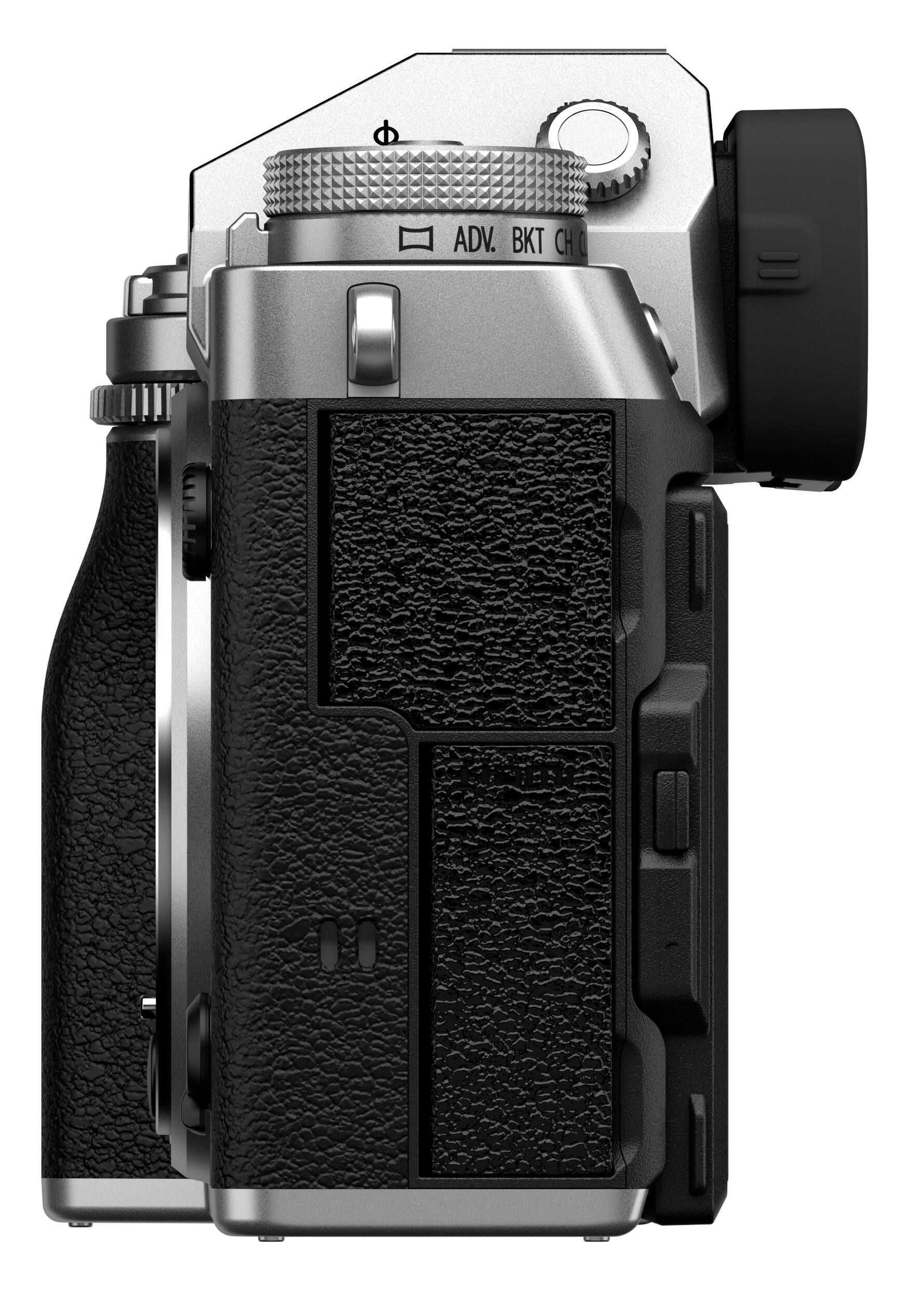 The image features a close-up of a digital camera, specifically an ADIX DT camera. The camera has a black and silver color scheme, with a black grip and a silver body. The camera is equipped with a lens, and the front of the camera is visible in the image. The focus of the image is on the camera's design and features, showcasing its compact and sleek appearance.
