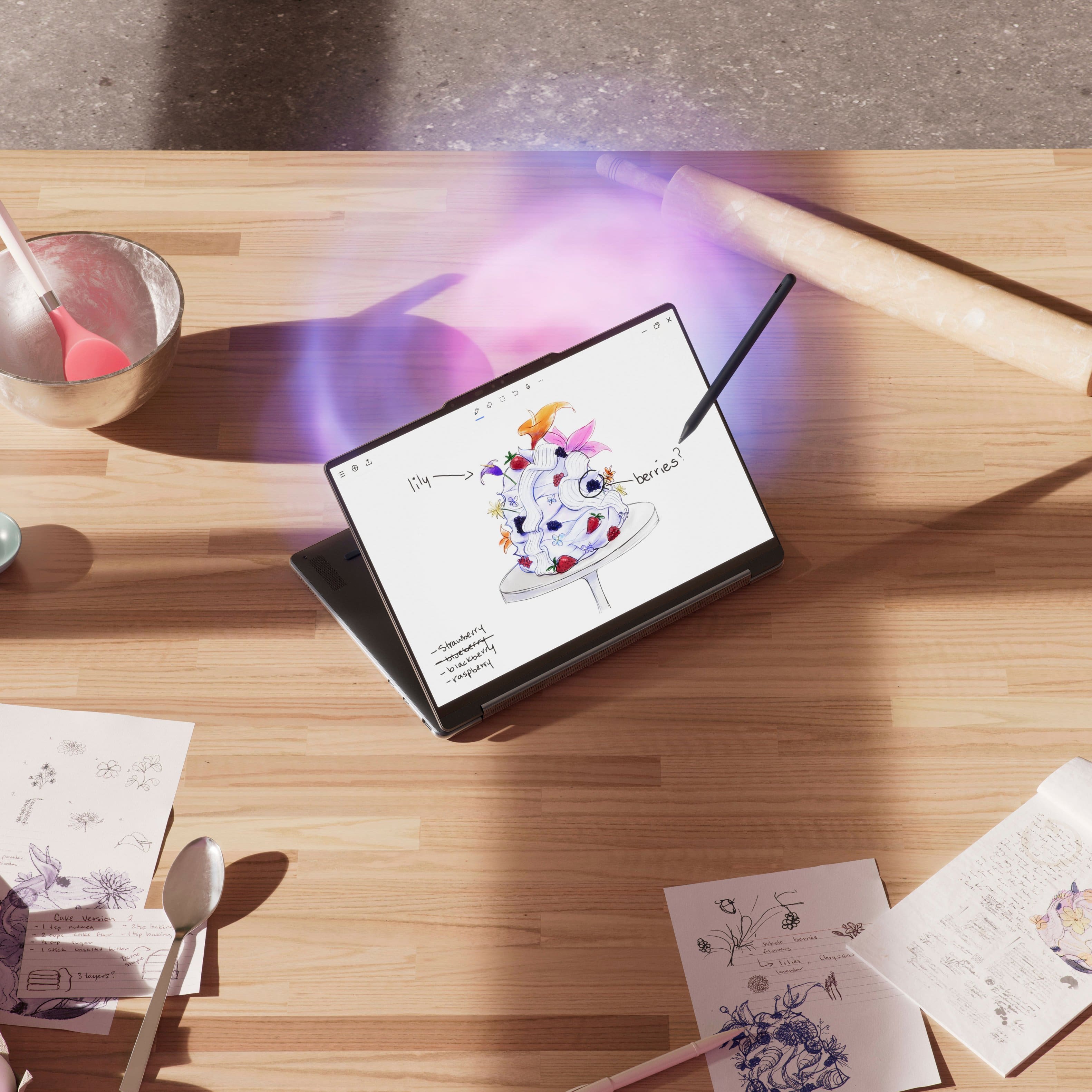 The image shows a table with a laptop on it, which is displaying a picture of a cake. There are also some papers and a bowl on the table. The text on the image is not coherent and does not provide any context or information about the scene.