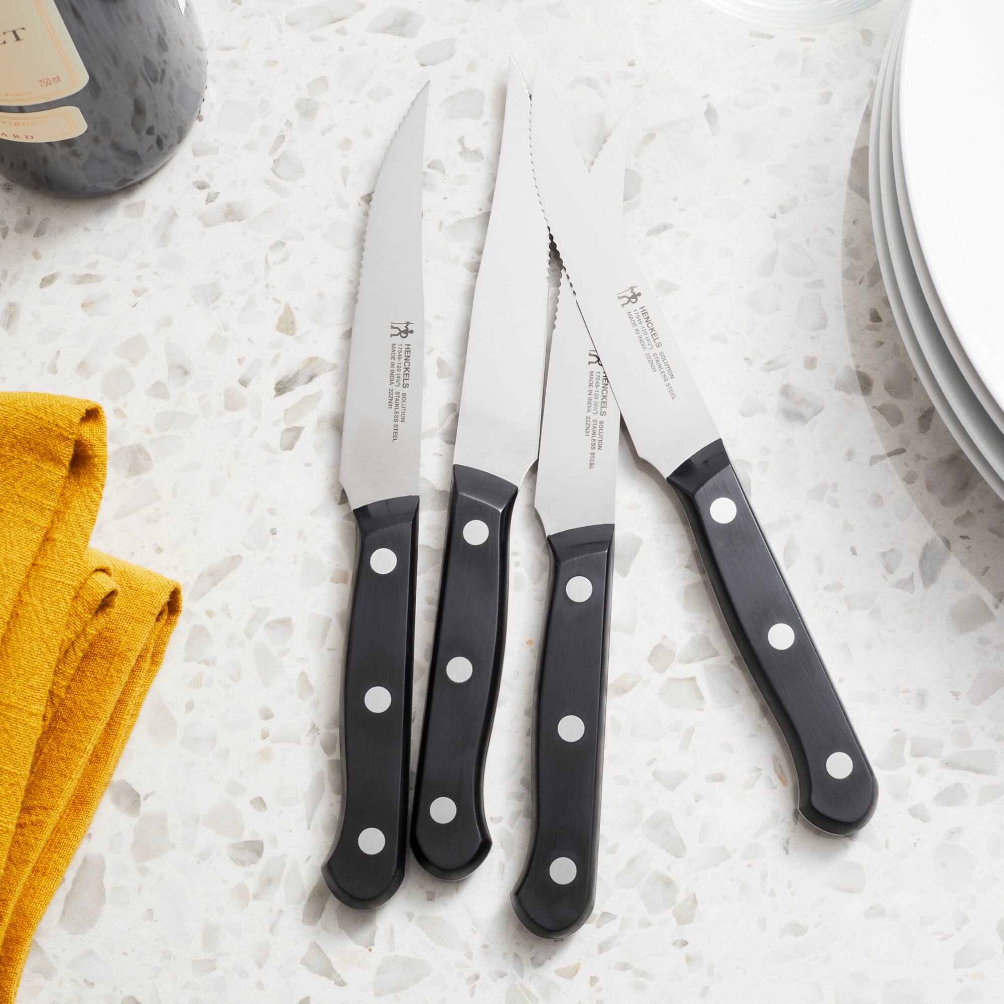 The text on the knives reads:

"J.A. HENCKELS
NEW YORK
NEW YORK, NY 10018
MADE IN GERMANY"