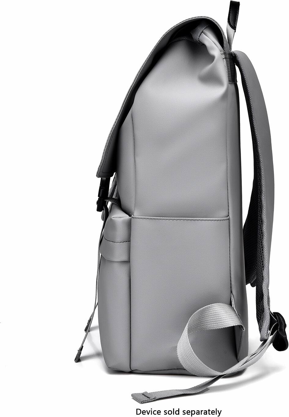 The image shows a backpack with a strap and a zippered pocket. The backpack is described as a "grey backpack" and "device sold separately." This suggests that the backpack is designed to carry a device, which is not included in the backpack itself. The backpack is placed against a white background, making it stand out prominently in the image.