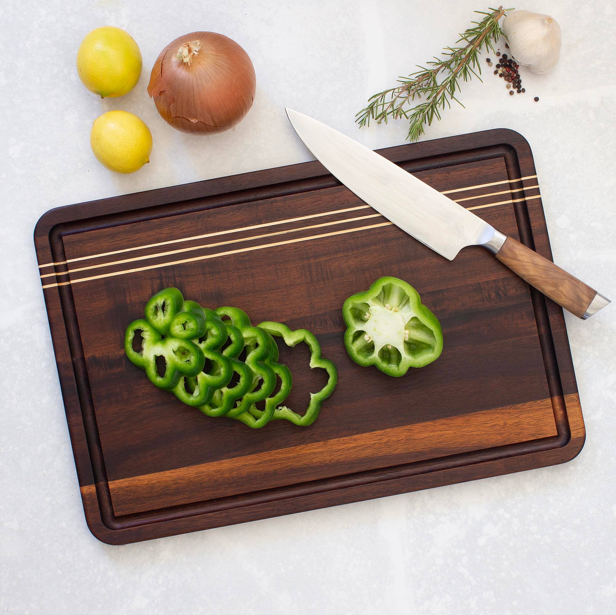 Angle. Rock & Branch - Acacia Wood Pinstripe Cutting Board, 18-1/8" x 12-1/8".