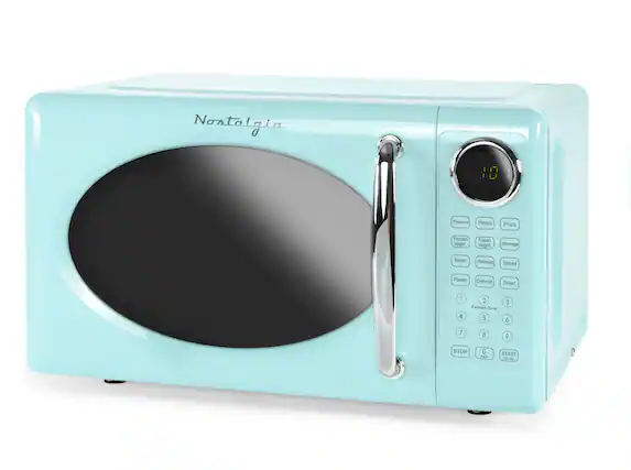 Nostalgia 880
Popcorn Potato Pizza Frozen Veget Fresh Vegetable Beverage Meat Reheat Bread Power Defrost Timer
1 2 3 Express Cook 4 5 6 7 8
STOP 0 START
Clock 30 sec