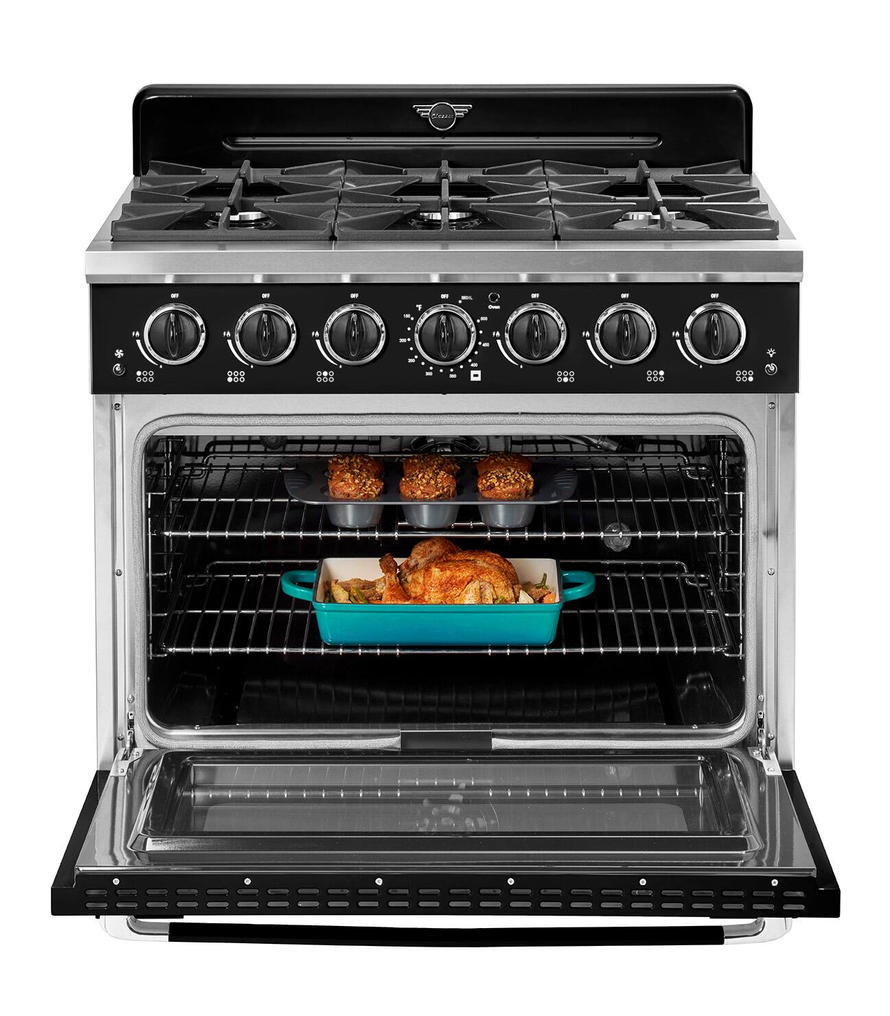 The image shows a stove with a turkey inside of it. The oven is filled with food, including a blue dish filled with chicken. The stove has a total of 11 burners, with 7 of them being visible in the image. The oven is open, revealing the delicious meal being cooked inside.