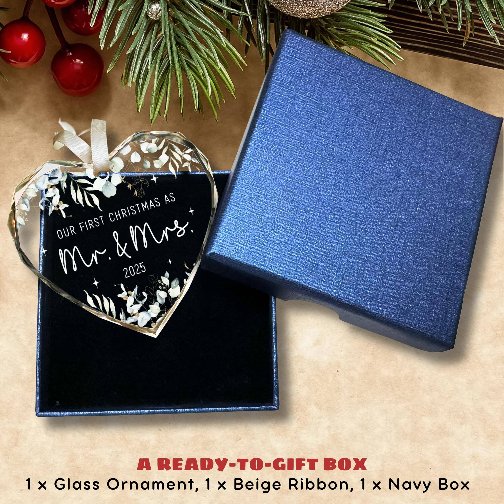 OUR FIRST CHRISTMAS AS  
Mr. & Mrs.  
2025  

A READY-TO-GIFT BOX  
1 x Glass Ornament, 1 x Beige Ribbon, 1 x Navy Box
