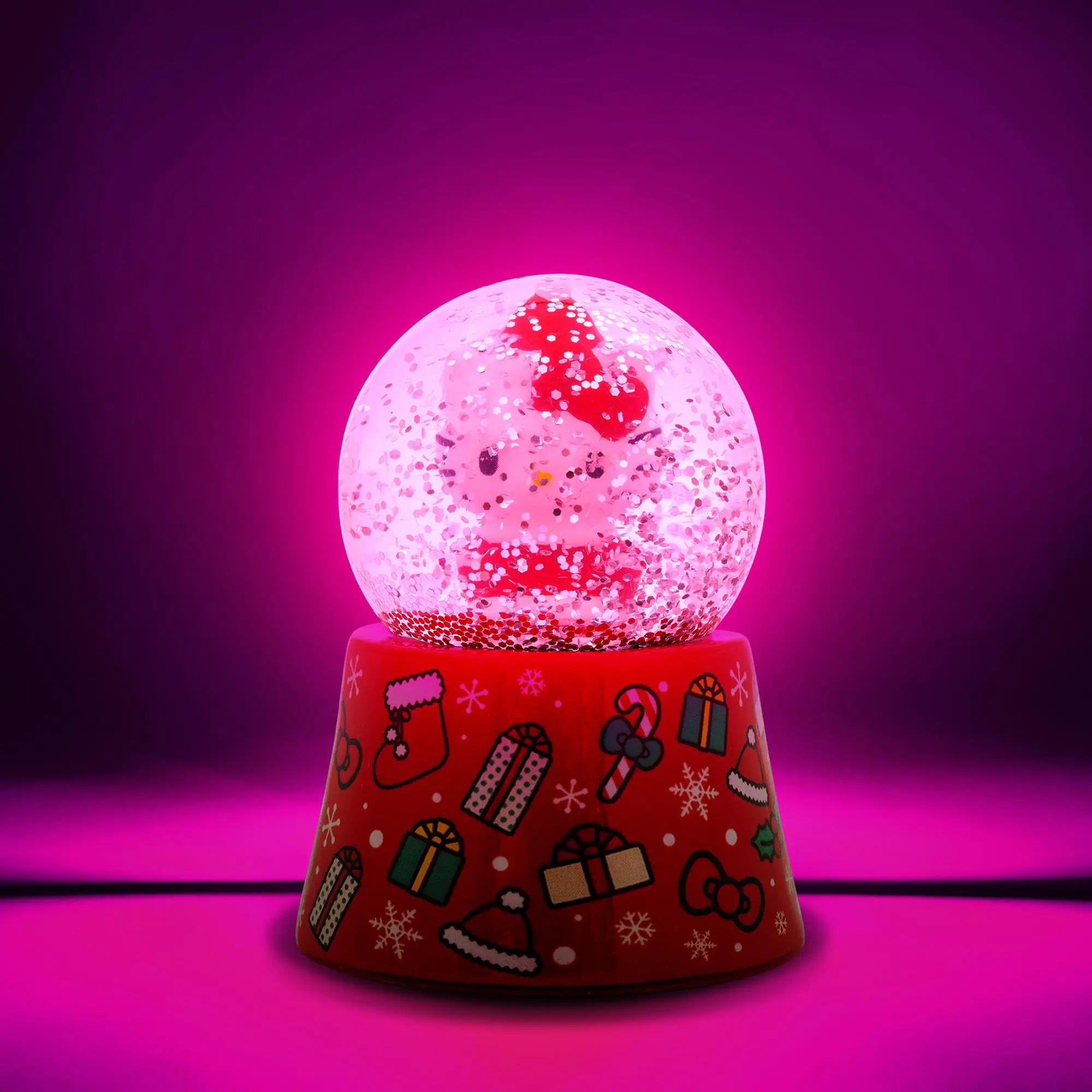 Alt View 1. Silver Buffalo - Sanrio Hello Kitty Holiday 3-Inch Mini Light-Up Snow Globe - Red.