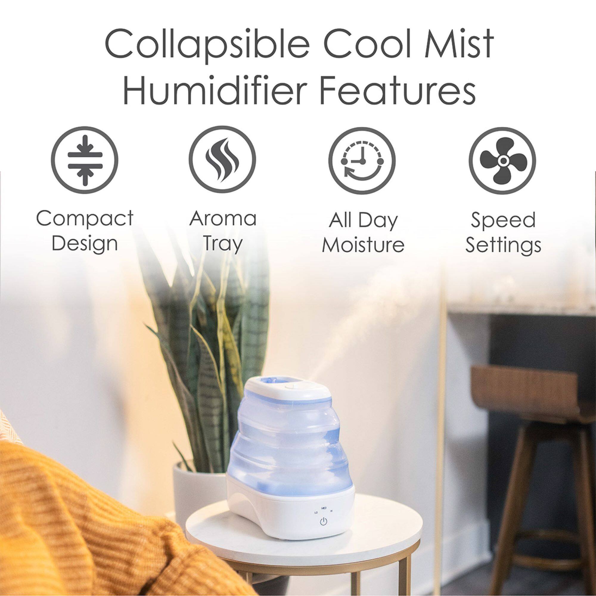 The image features a compact design humidifier with a collapsible cool mist function. It has an aroma tray for added fragrance and offers adjustable speed settings for customizable moisture levels throughout the day. The humidifier is sitting on a table, and a potted plant is nearby, adding a touch of greenery to the scene.