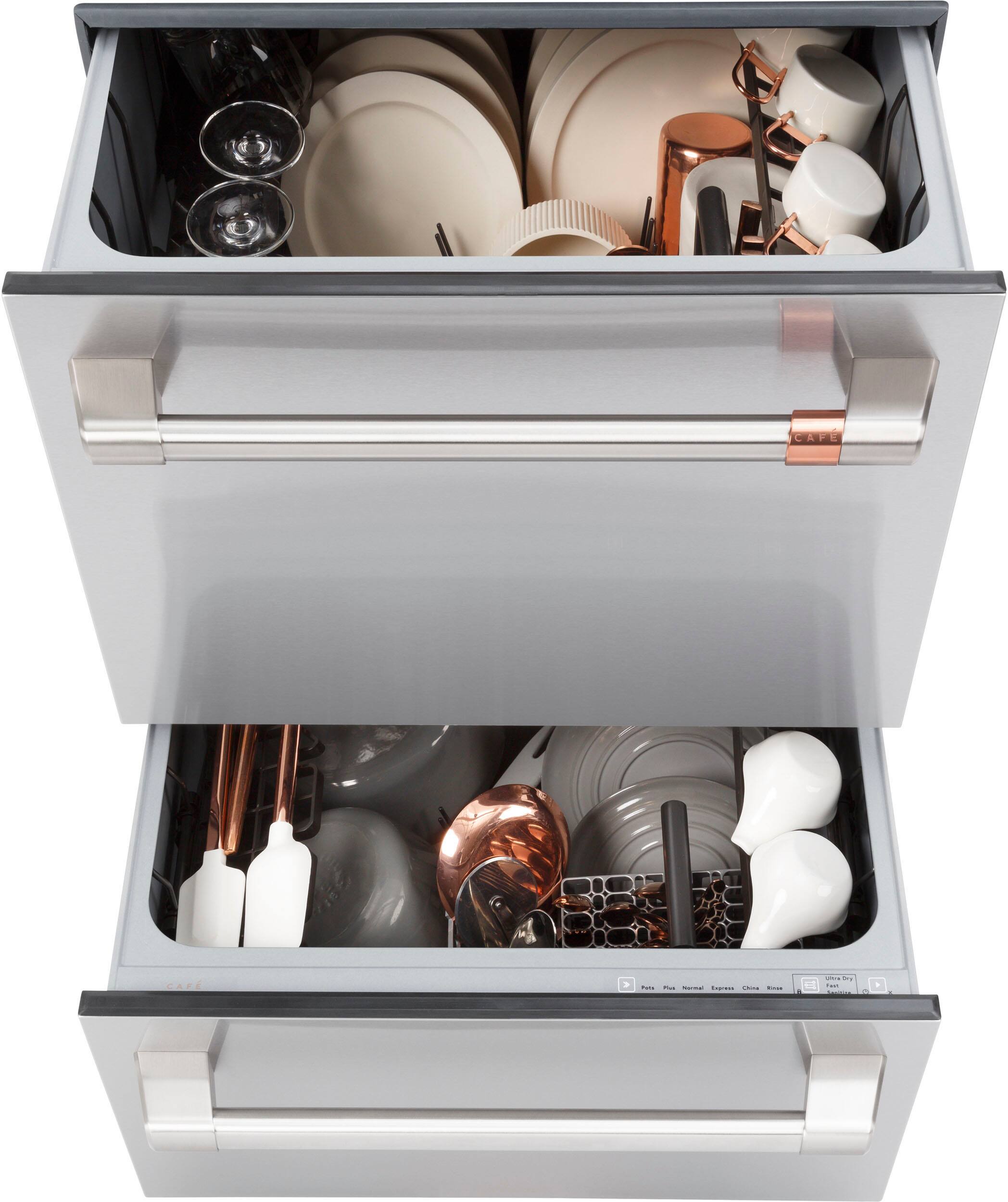 The image shows two open drawers filled with various kitchen utensils and dishes. The drawers contain a variety of items, including cups, spoons, and bowls. The cups are located in the top drawer, while the spoons and bowls are placed in the bottom drawer. The arrangement of the utensils and dishes in the drawers suggests a well-organized and functional storage system for the kitchen.