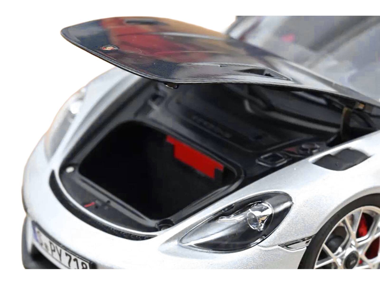 Left. Norev - 2023 Porsche 718 Spyder RS Weissach Pack GT Silver Metallic with Carbon Hood 1/18 Diecast Model Car by Norev - Silver Metallic.