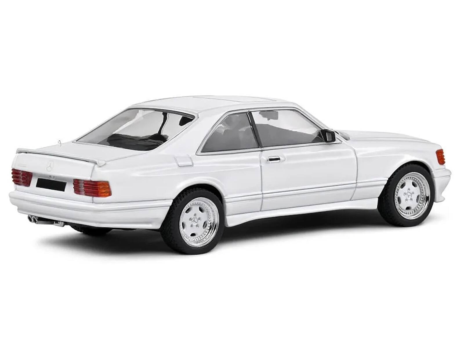Left. Solido - 1990 Mercedes-Benz 560 SEC AMG WideBody Classic White 1/43 Diecast Model Car by Solido - White.
