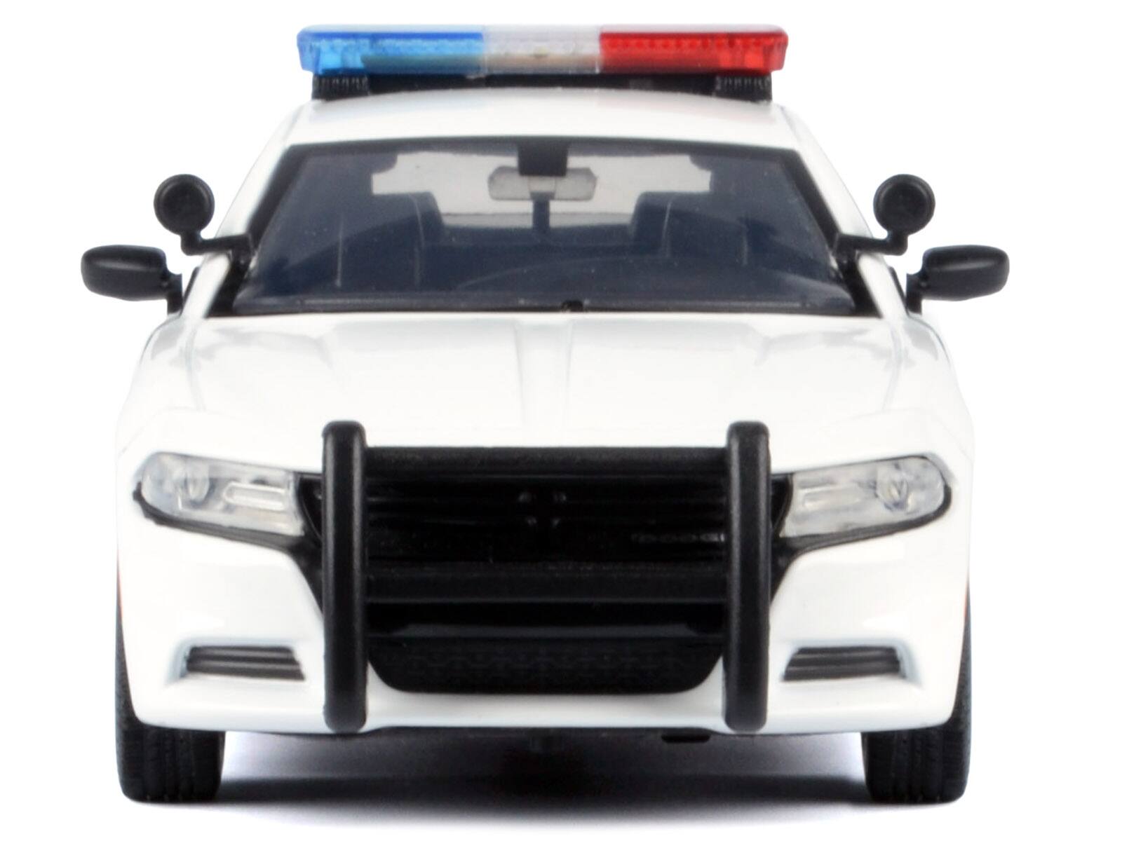 Alt View 2. Motormax - 2023 Dodge Charger Pursuit Police Car Unmarked White w/Light Bar Front & Rear Lights & Sounds 1/24 Model Car by Motormax.