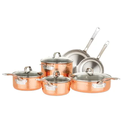 The image features a set of four copper pots and pans, including a large pot, a small pot, and two frying pans. The pots and pans are arranged in a visually appealing manner, showcasing their metallic finish. The copper pots and pans are likely used for cooking and are designed to provide even heat distribution, making them a popular choice for chefs and home cooks alike.