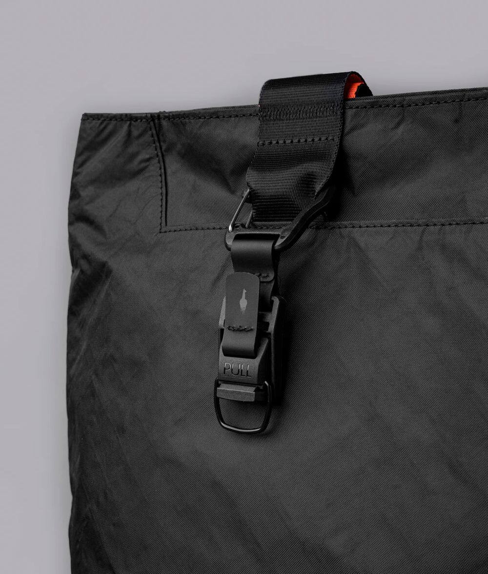 Alt View 5. ALPAKA - Elements Tote Bag 14.5L Weatherproof Foldable Travel Tote with Magnetic Closure - Black Axoflux 210D.