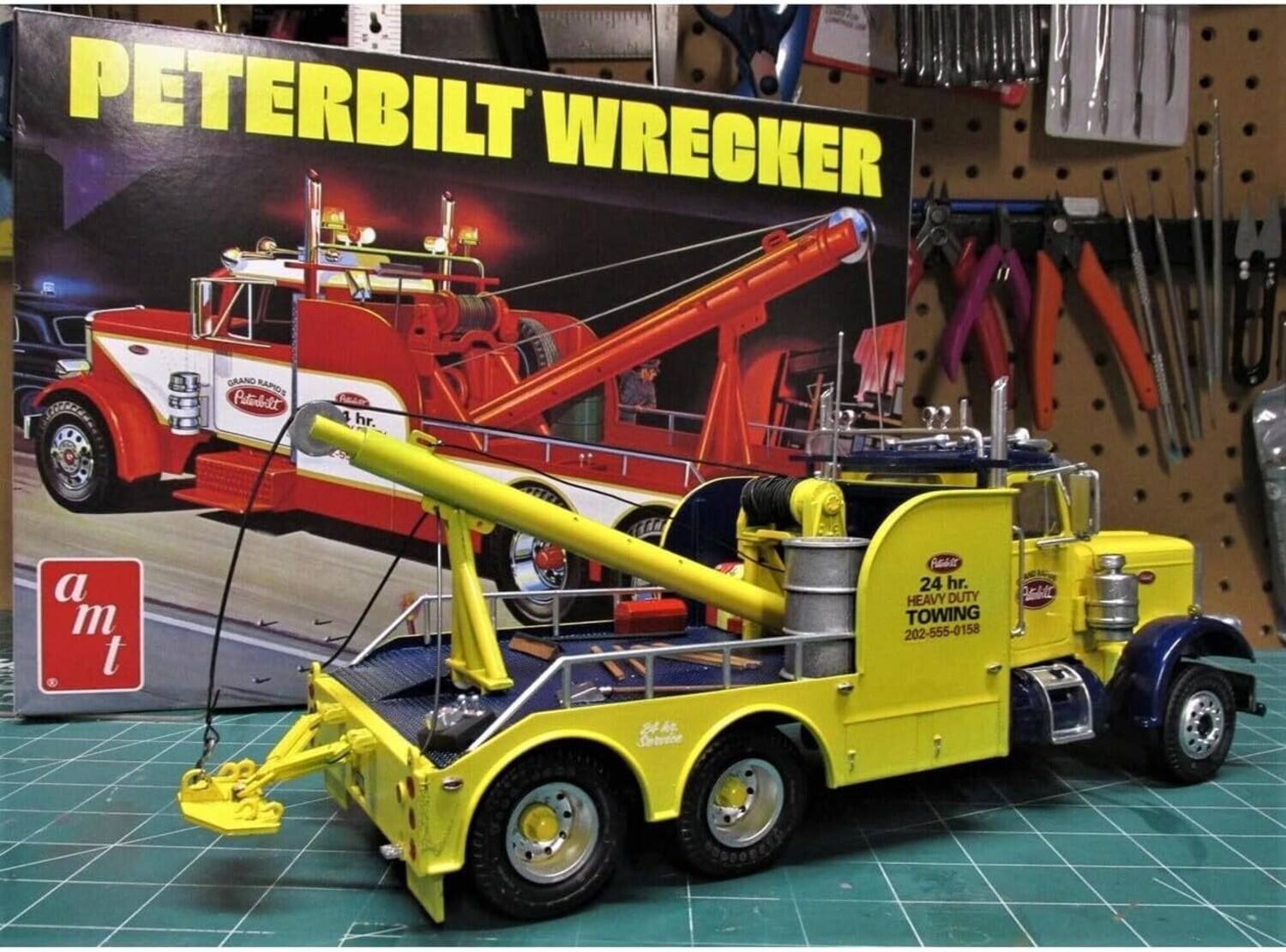 PETERBILT WRECKER  
GRAND RAPIDS  
24 hr.  
HEAVY DUTY TOWING  
202-555-0158  

a m t