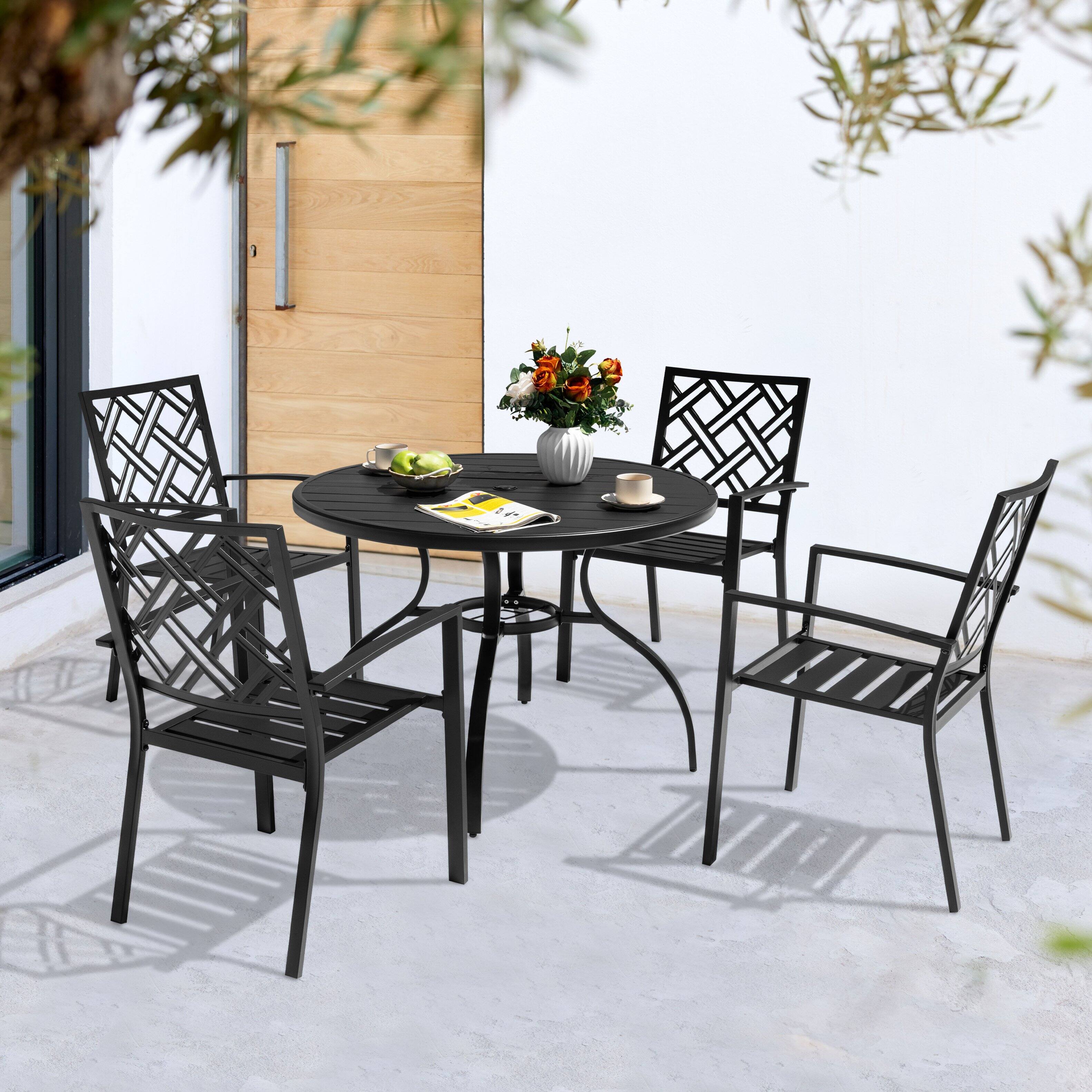 Angle. Nuu Garden - 5-Piece Metal Round Outdoor Dining Set with Umbrella Hole and 4 Stackable Chairs - Black.