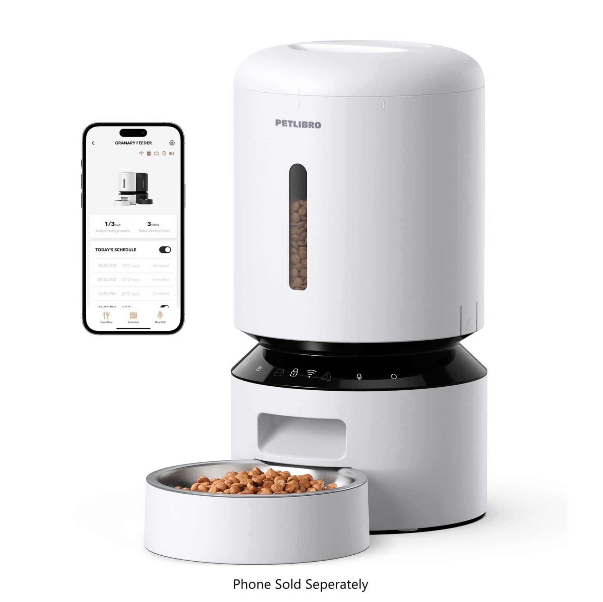 The image shows a white Petlibro 4 coffee maker with a bowl of coffee beans placed on top of it. The coffee maker is accompanied by a smartphone, which is likely used for controlling the coffee maker or providing information about the coffee-making process. The image also includes a bowl of coffee beans, which are being used to make coffee. The text on the image suggests that the coffee maker is a Petlibro 4 Granart, and the phone is sold separately.