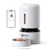 The image shows a white Petlibro 4 coffee maker with a bowl of coffee beans placed on top of it. The coffee maker is accompanied by a smartphone, which is likely used for controlling the coffee maker or providing information about the coffee-making process. The image also includes a bowl of coffee beans, which are being used to make coffee. The text on the image suggests that the coffee maker is a Petlibro 4 Granart, and the phone is sold separately.
