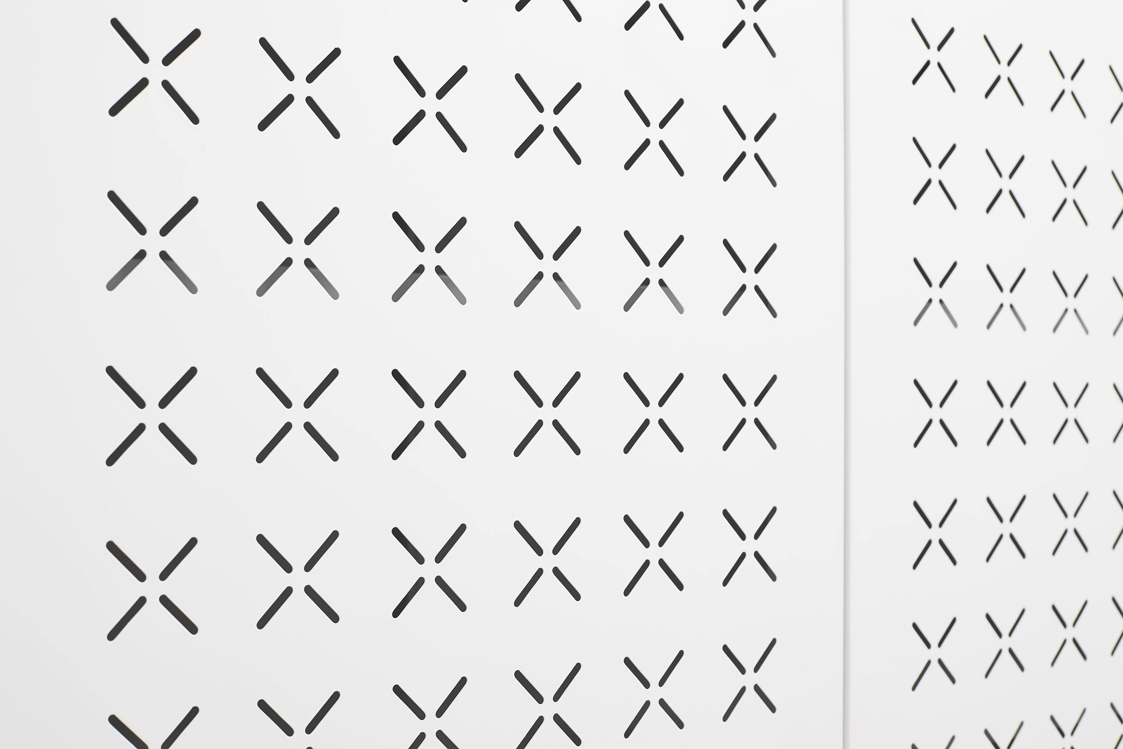 The image contains a pattern of crosses in various shades of gray. There is no text to group or correct.