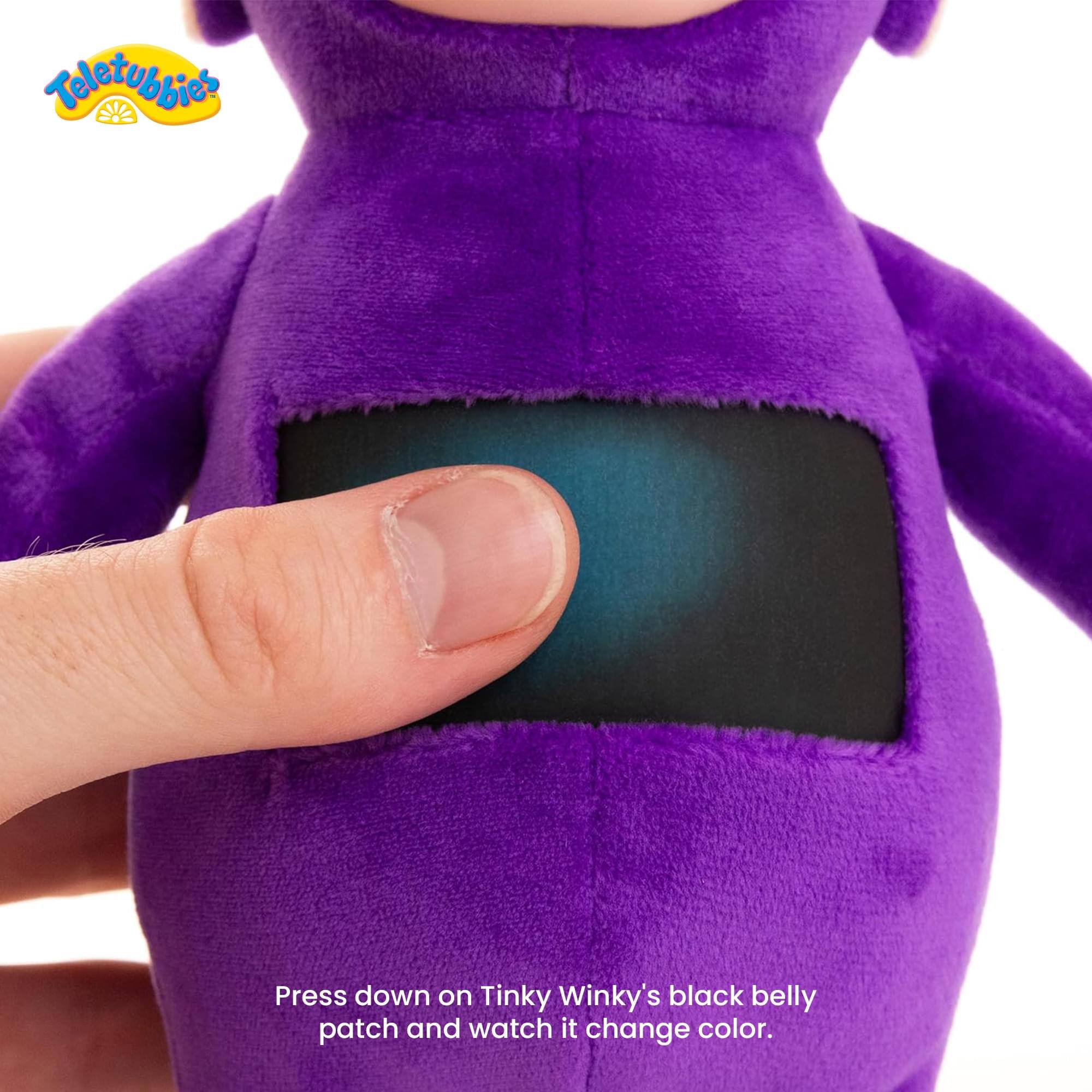 Press down on Tinky Winky's black belly patch and watch it change color.