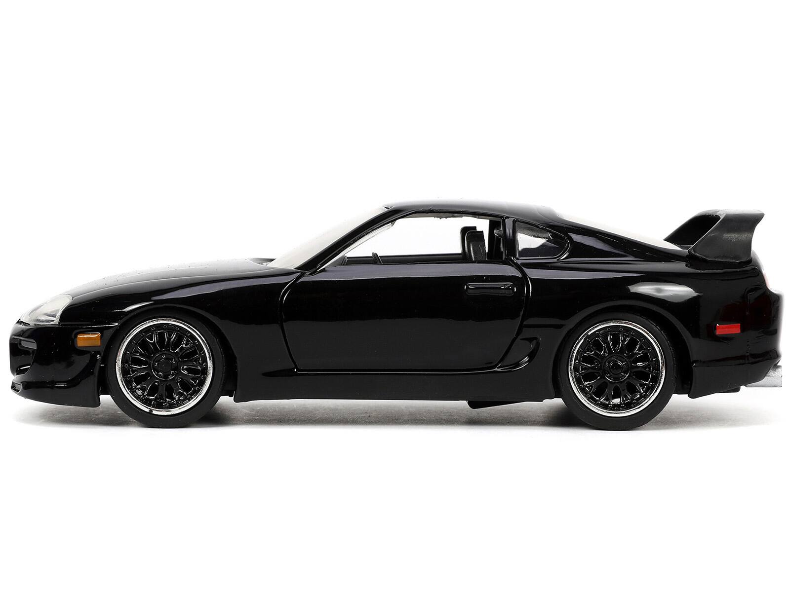 Left. Jada - 1995 Toyota Supra Black "Fast & Furious" Movie 1/32 Diecast Model Car by Jada - Black.