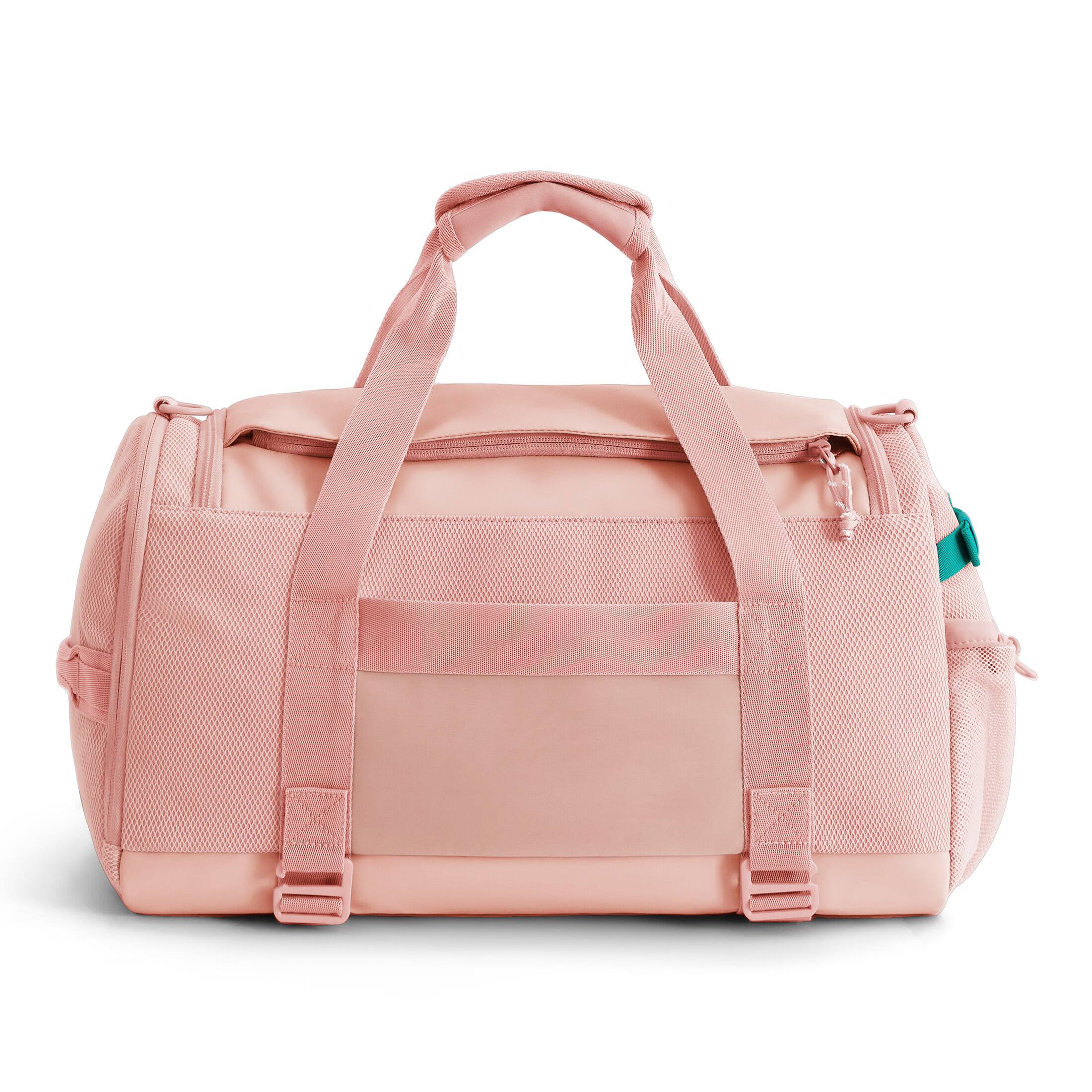 Angle. Bagsmart - REIKI Duffle 30L Travel Gym Bag with 15.6" Laptop Sleeve, Separate Shoe Compartment & Trolley Pass-Through - Impatiens Pink.
