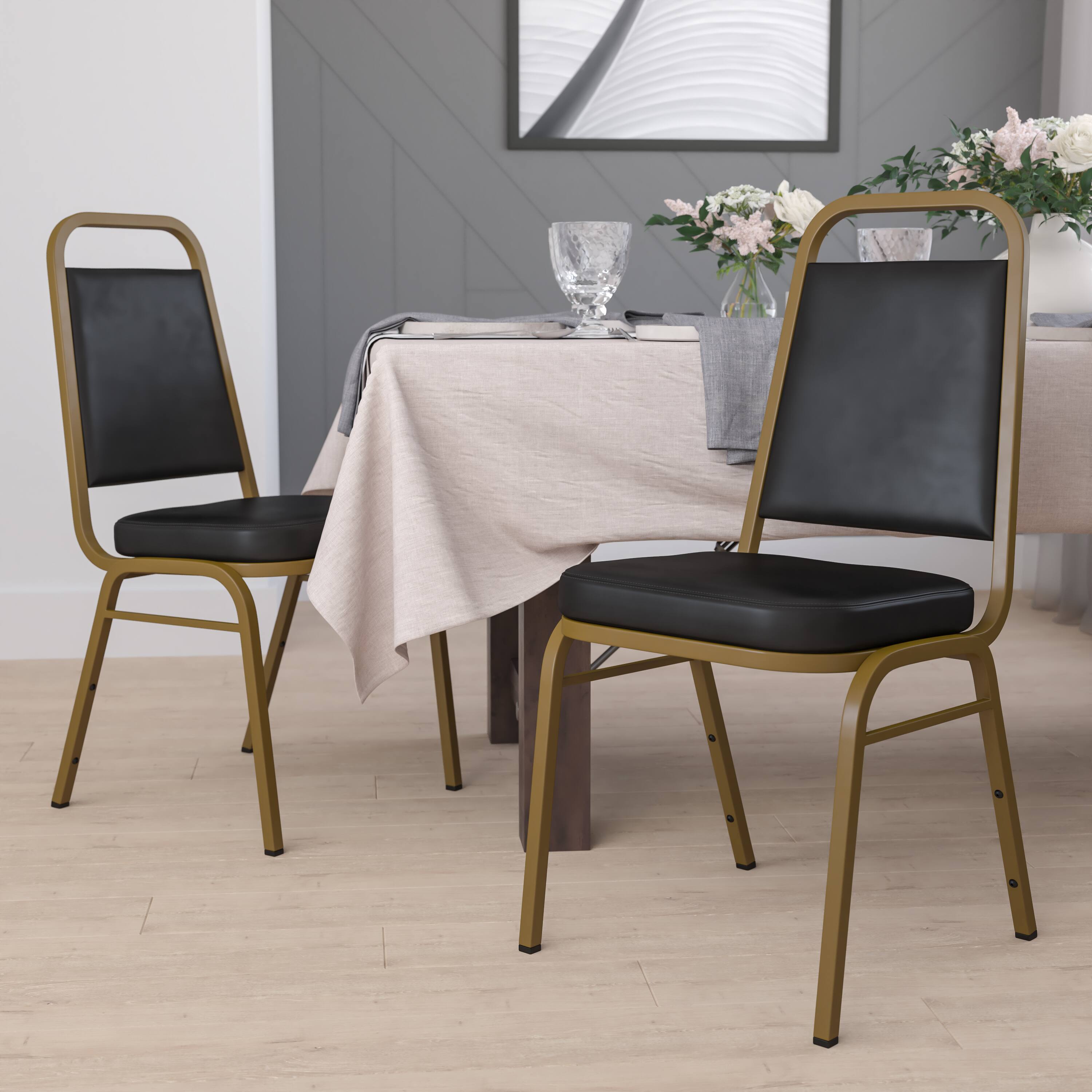 Alt View 2. Emma + Oliver - 4 Pack Trapezoidal Back Stacking Banquet Chair - Black Vinyl/Gold Frame.