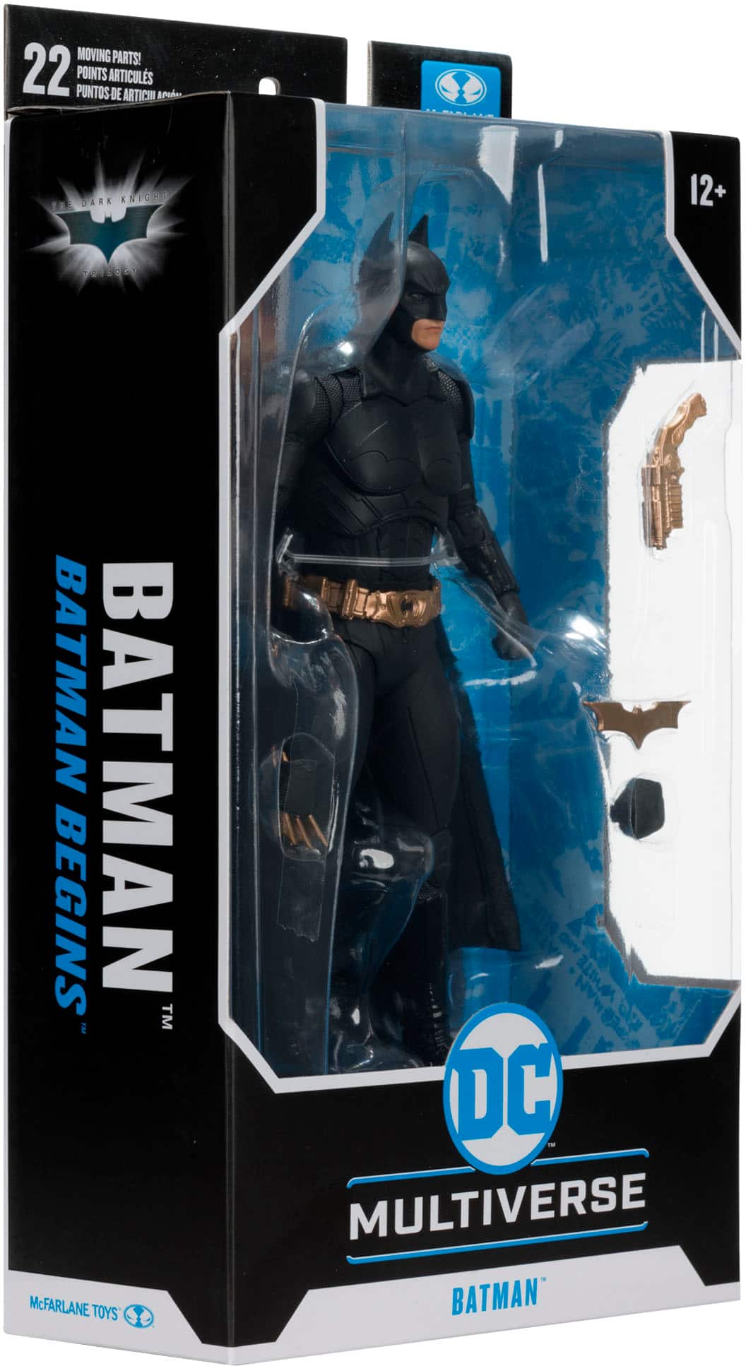 The image features a Batman Begins action figure from the DC Multiverse line. The figure is dressed in a black suit and is posed in a dynamic stance. The packaging is designed to showcase the figure and its various articulations, making it an attractive display for collectors and fans of the Batman franchise.
