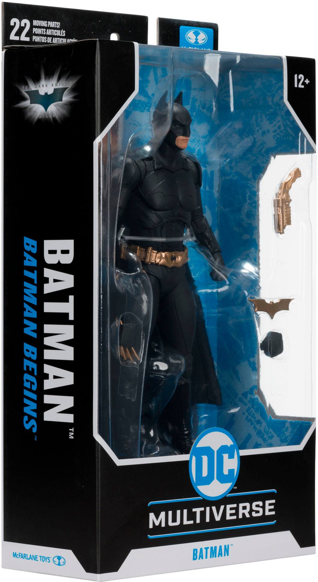 The image features a Batman Begins action figure from the DC Multiverse line. The figure is dressed in a black suit and is posed in a dynamic stance. The packaging is designed to showcase the figure and its various articulations, making it an attractive display for collectors and fans of the Batman franchise.