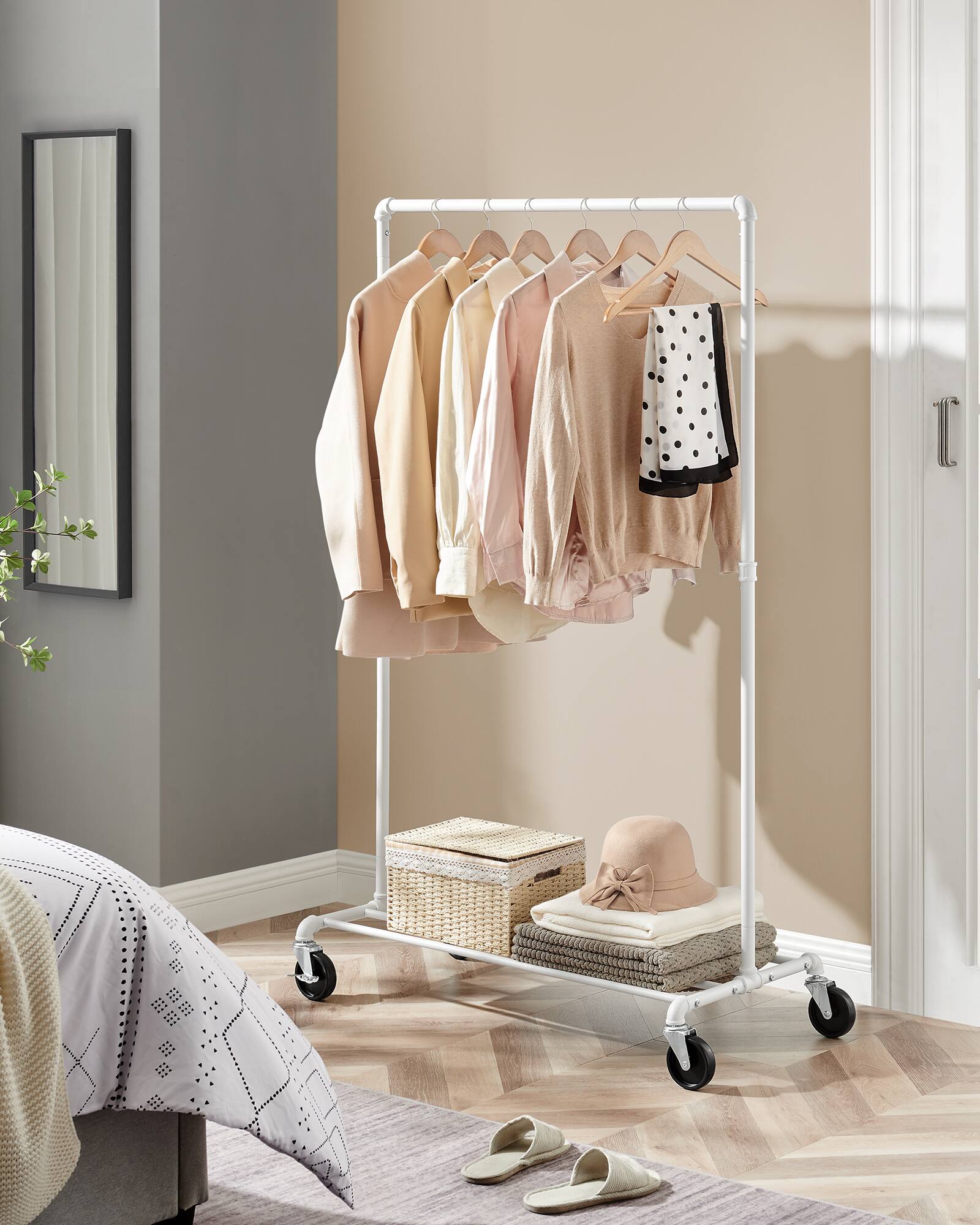 Left. Songmics Home - Heavy-Duty Clothes Rack, Clothing Rack for Hanging Clothes, Industrial Garment Rack on Wheels, Metal Frame - Matte White.