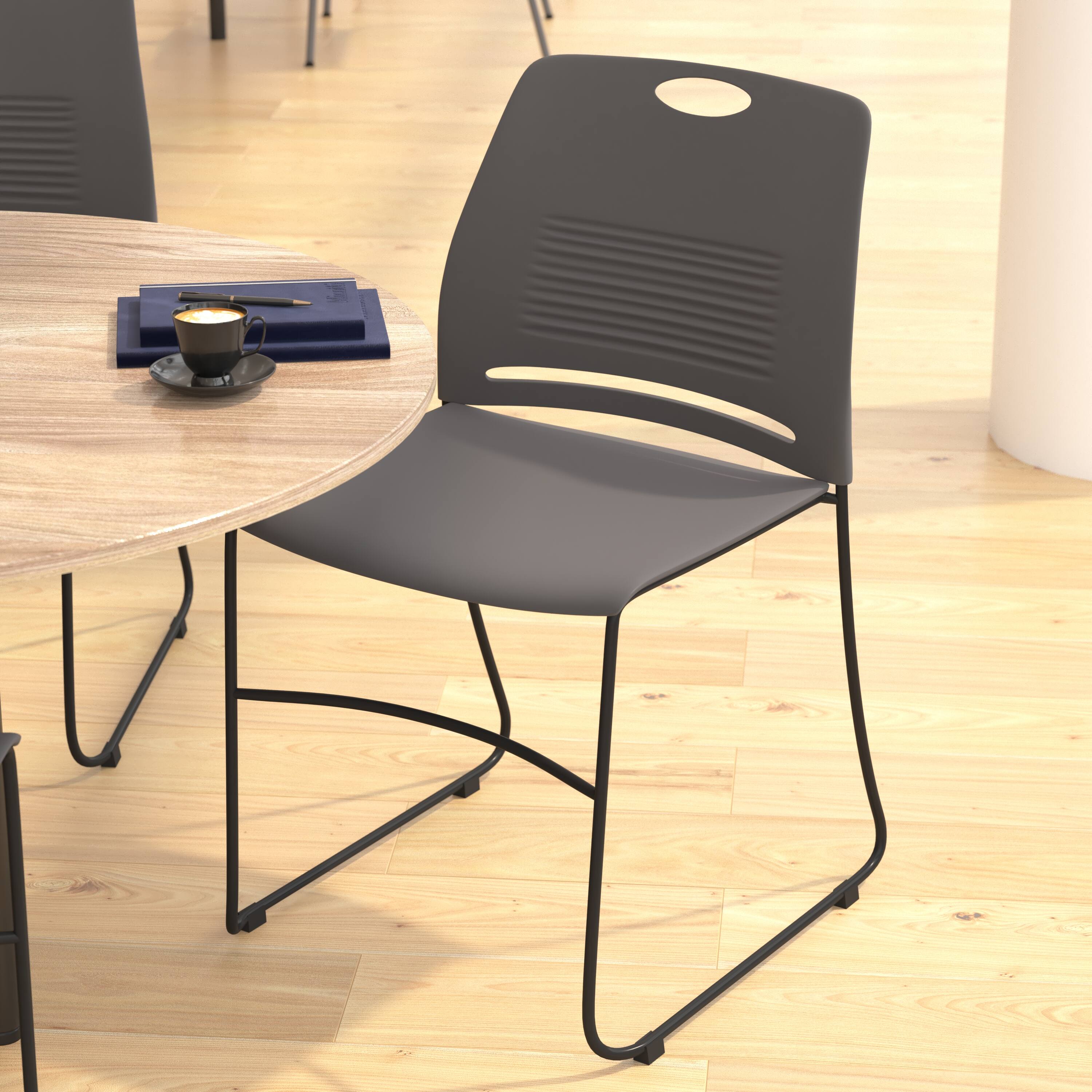 Alt View 5. Emma + Oliver - Heavy Duty 660 lb. Capacity Plastic Stack Chair with Steel Sled Base Frame - Gray.