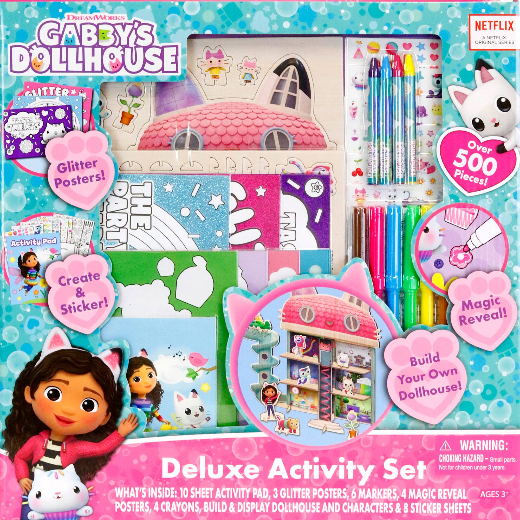 The image features a Gabby's Dollhouse Deluxe Activity Set, which includes a variety of items for children to enjoy. The set contains a 10-sheet activity pad, three glitter posters, six markers, four magic reveal posters, four crayons, a build and display dollhouse, and eight sticker sheets. The set is designed for children aged 3 and up and comes with a warning that small parts may pose a choking hazard. The Deluxe Set is not intended for children under 3 years old.