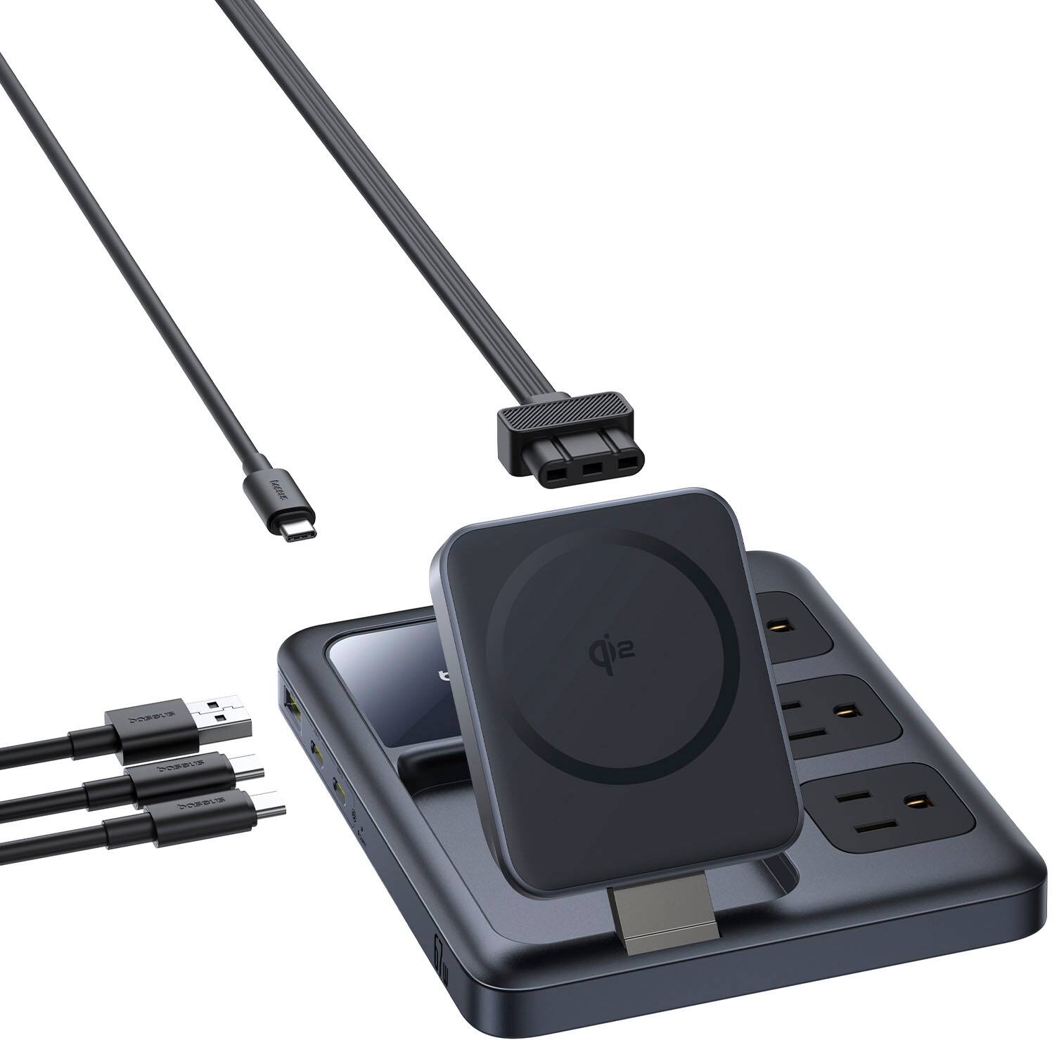 The image features a black device with a USB plugged into it, sitting on a charging station. There are also several cords and a power strip in the scene. The device is likely being charged or connected to a computer or other device.