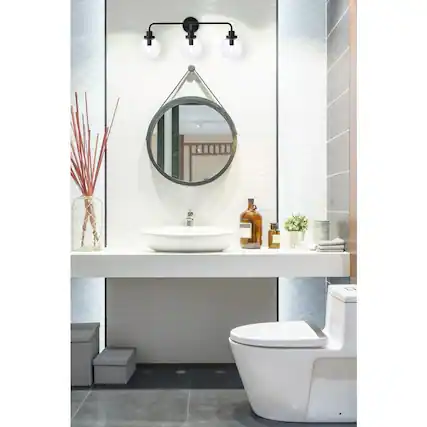 Front. Living District - Hanson 3 lights bath sconce in black with clear shade - Black And Clear Shade.