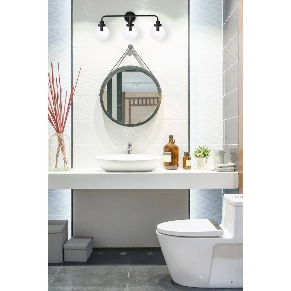 Front. Living District - Hanson 3 lights bath sconce in black with clear shade - Black And Clear Shade.