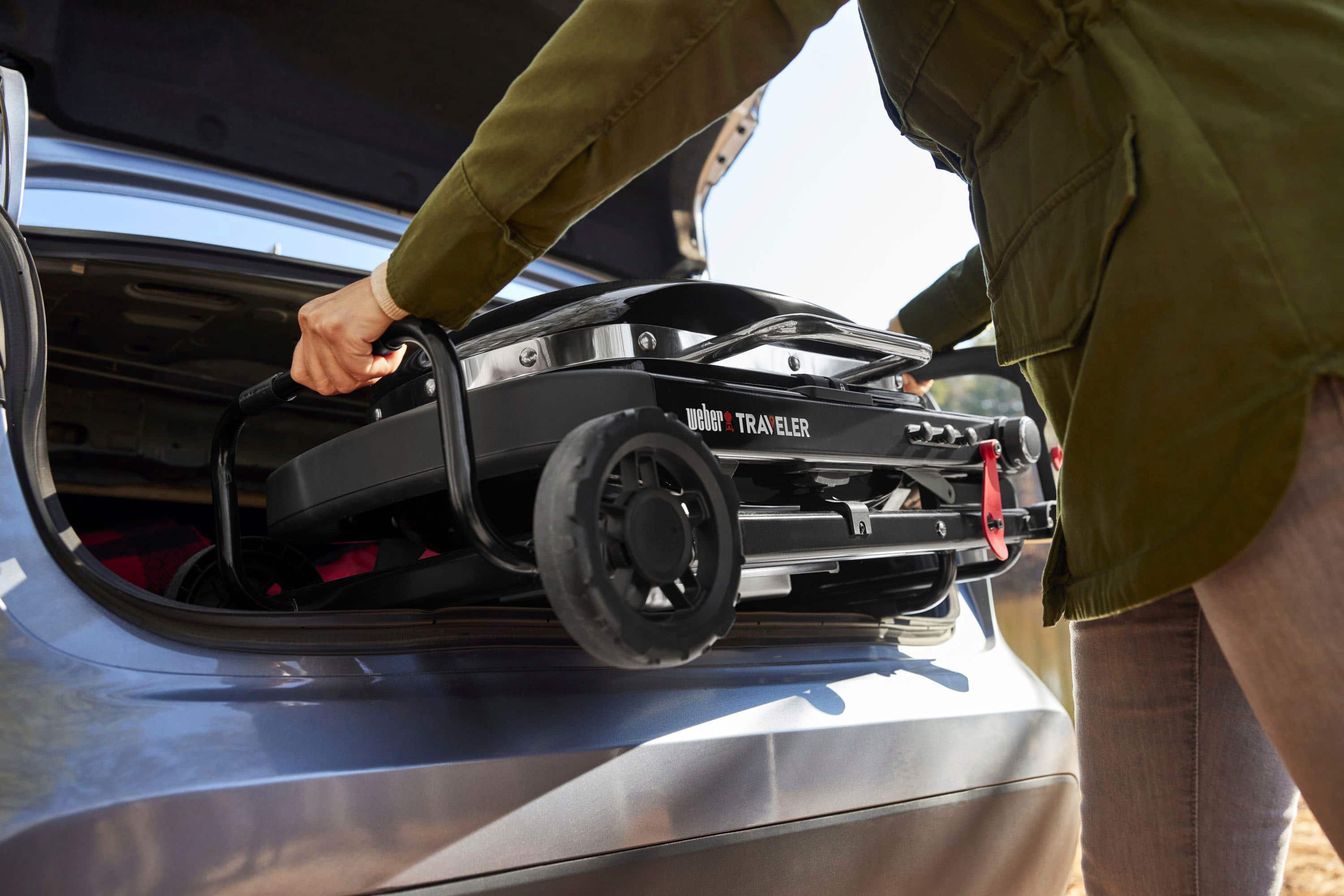 The text on the image reads "weber TRAVELER TRAVELER."