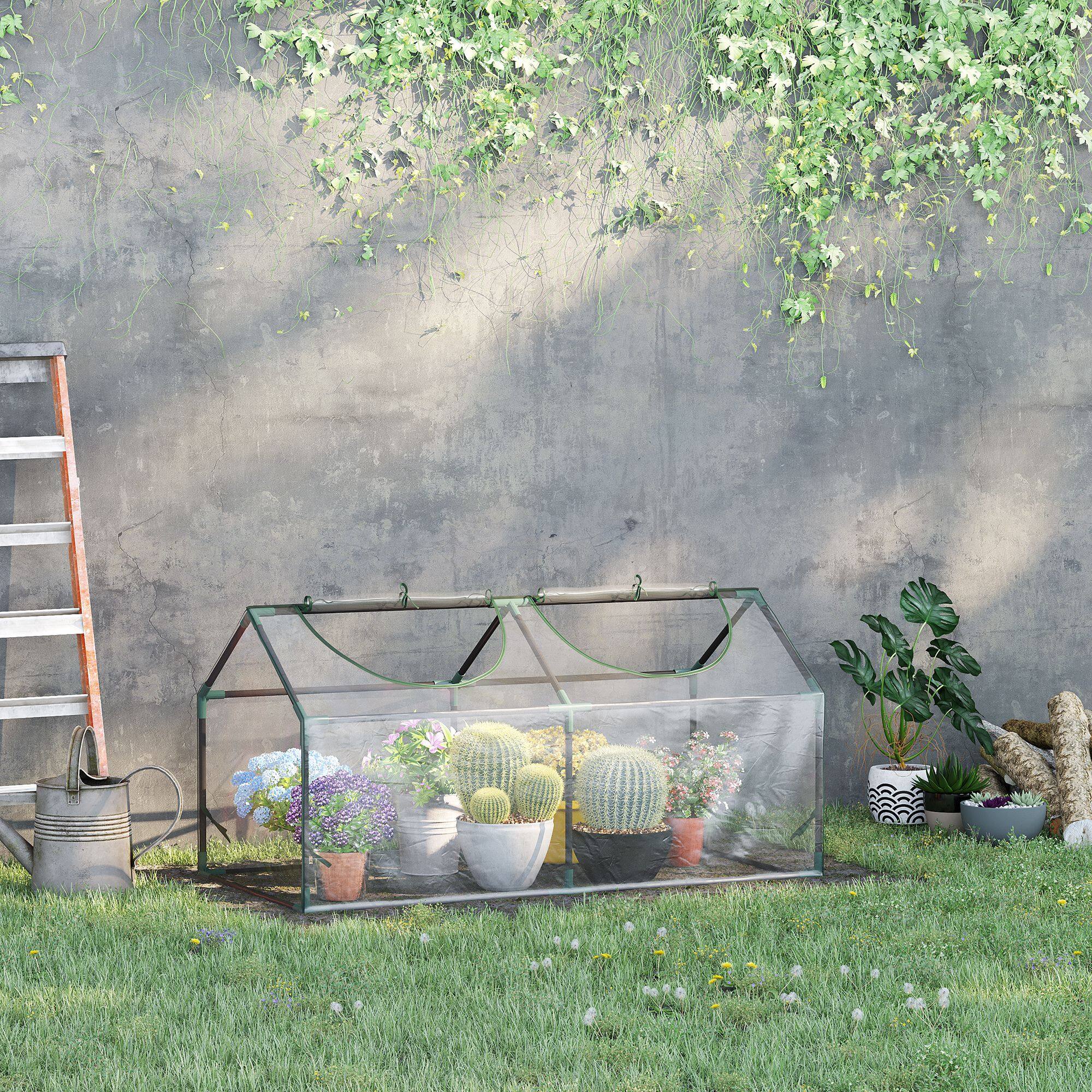 Alt View 1. Outsunny - 4' x 2' x 2' Portable Mini Greenhouse, Small Green House with PVC Cover, Roll-up Zippered Windows for Indoor.