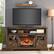 Angle. Mondawe - 60" Electric Fireplace Entertainment Center With Door Sensor - Brown.