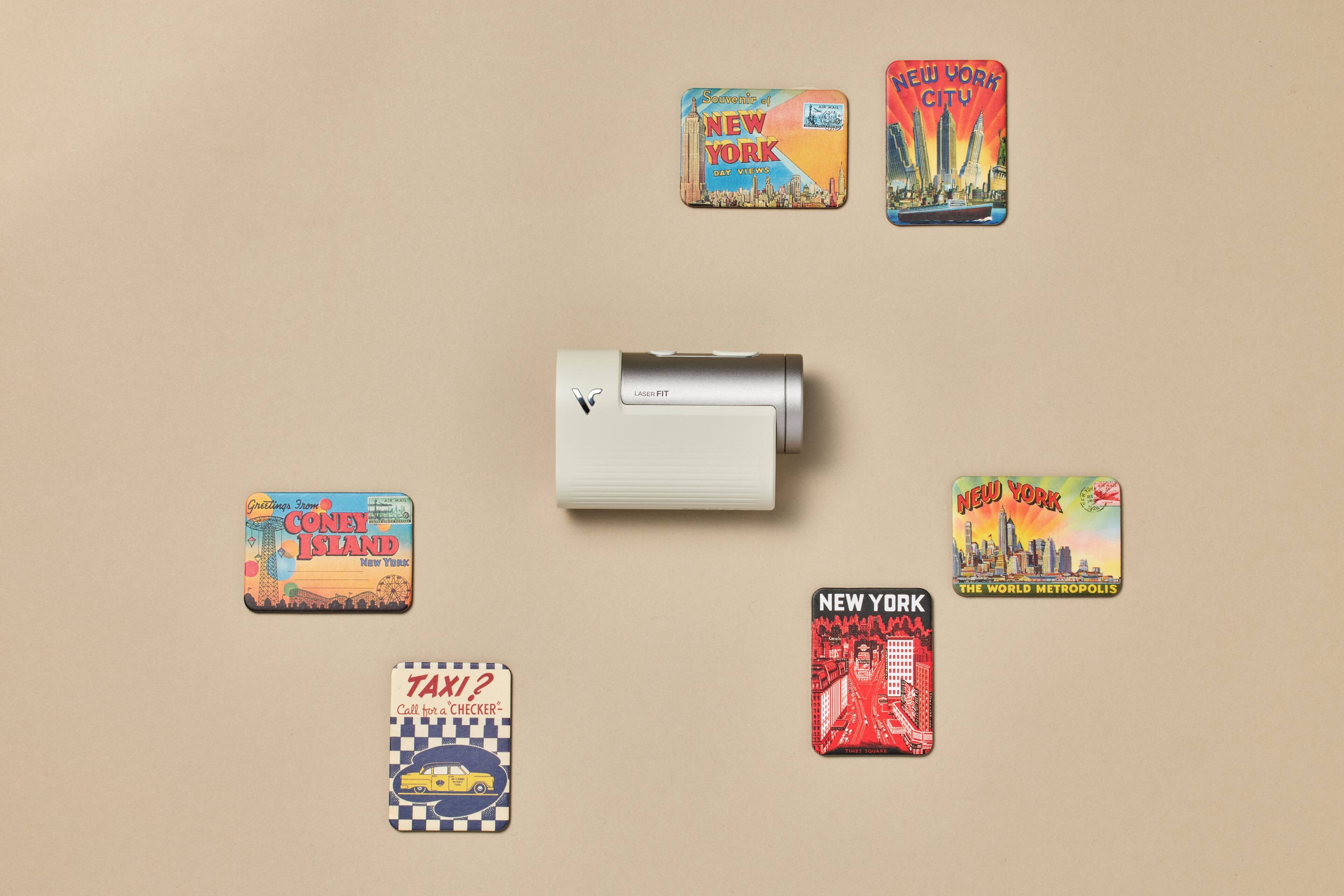 The text on the image can be grouped and corrected as follows:

1. Souvenir of New York:
"Souvenir of New York: The World Metropolis"
2. Coney Island:
"Coney Island"
3. Taxi?:
"Call for a Checker - An - A"
4. Laser HT:
"Laser HT"
5. Grattings:
"Grattings"

The corrected text is:

1. Souvenir of New York: The World Metropolis
2. Coney Island
3. Taxi?: Call for a Checker - An - A
4. Laser HT
5. Grattings