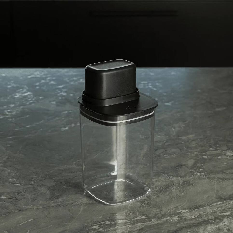 Left. OU - 4 Cup Clear Airtight Food Storage Container with Measuring Cup for Sugar, Coffee & Dry Food - Black.