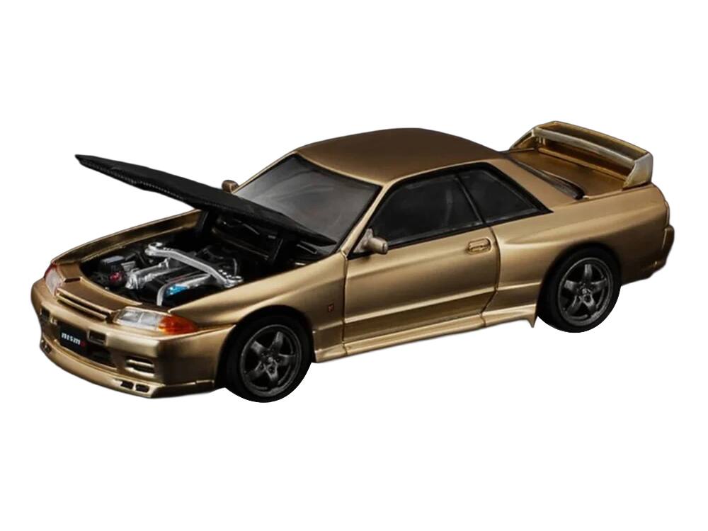Angle. Pop Race - Skyline GT-R R32 RHD (Right Hand Drive) Chrome Gold with Carbon Hood "Tokyo Auto Salon 2025" 1/64 - Chrome Gold.