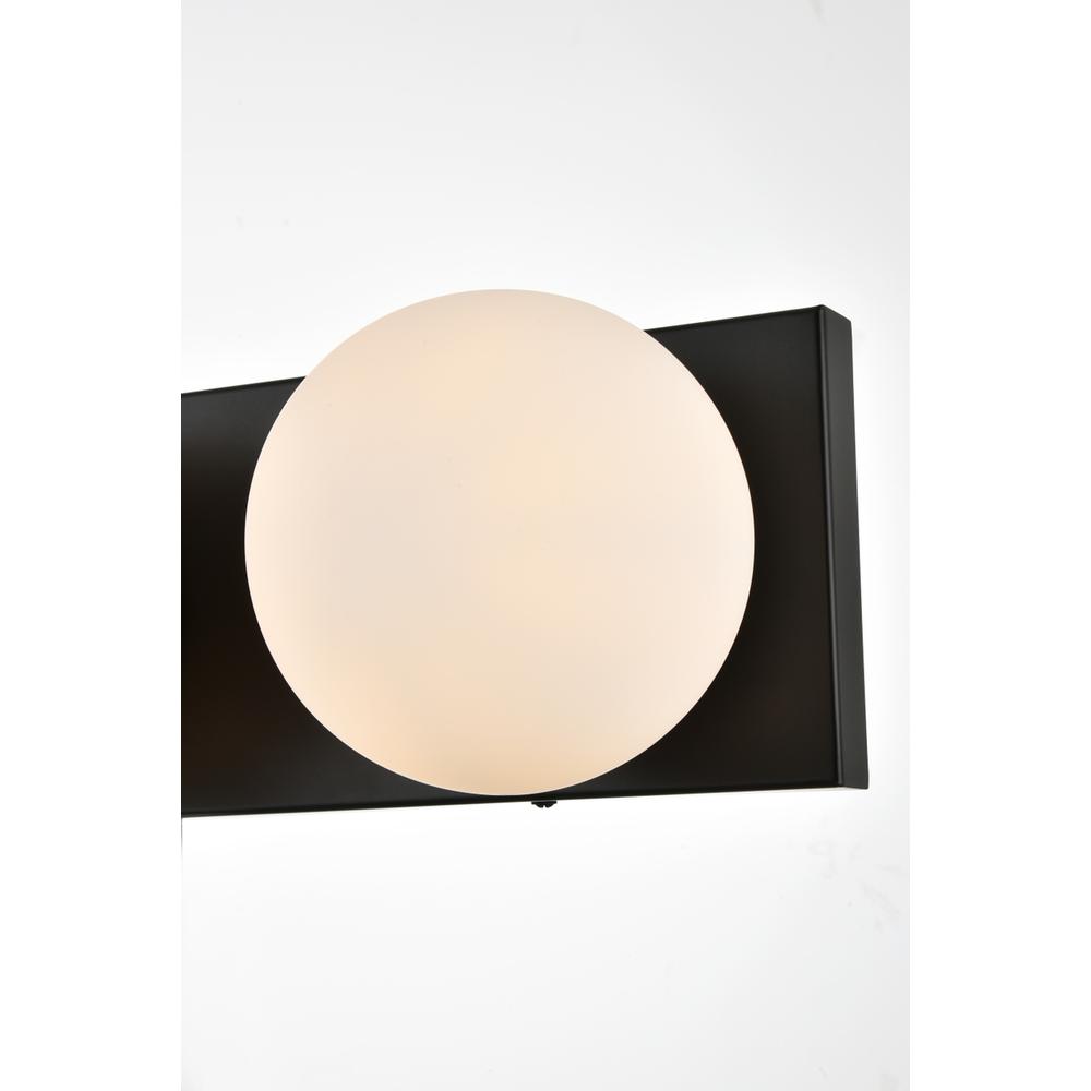 Left. Living District - Jaylin 3 light Black and frosted white Bath Sconce - Black And Frosted White.