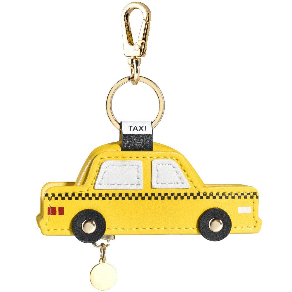Angle. Posh Tech - Taxi Leather Bag Charm for Airtag® - Yellow.