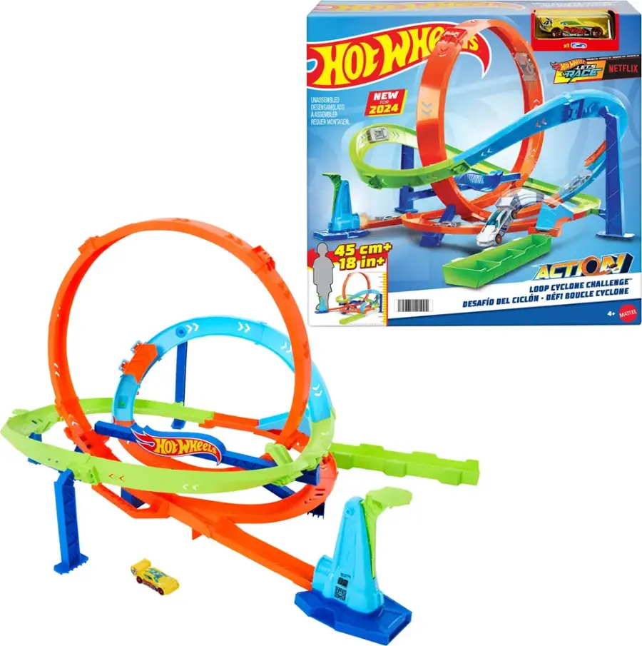 The image features a toy carousel, which is part of the Hot Wheels brand. The carousel is shown in its unassembled state, ready to be put together. The toy is designed to be a fun and challenging addition to the Hot Wheels collection. The box for the carousel is also displayed, showcasing the product and its features.