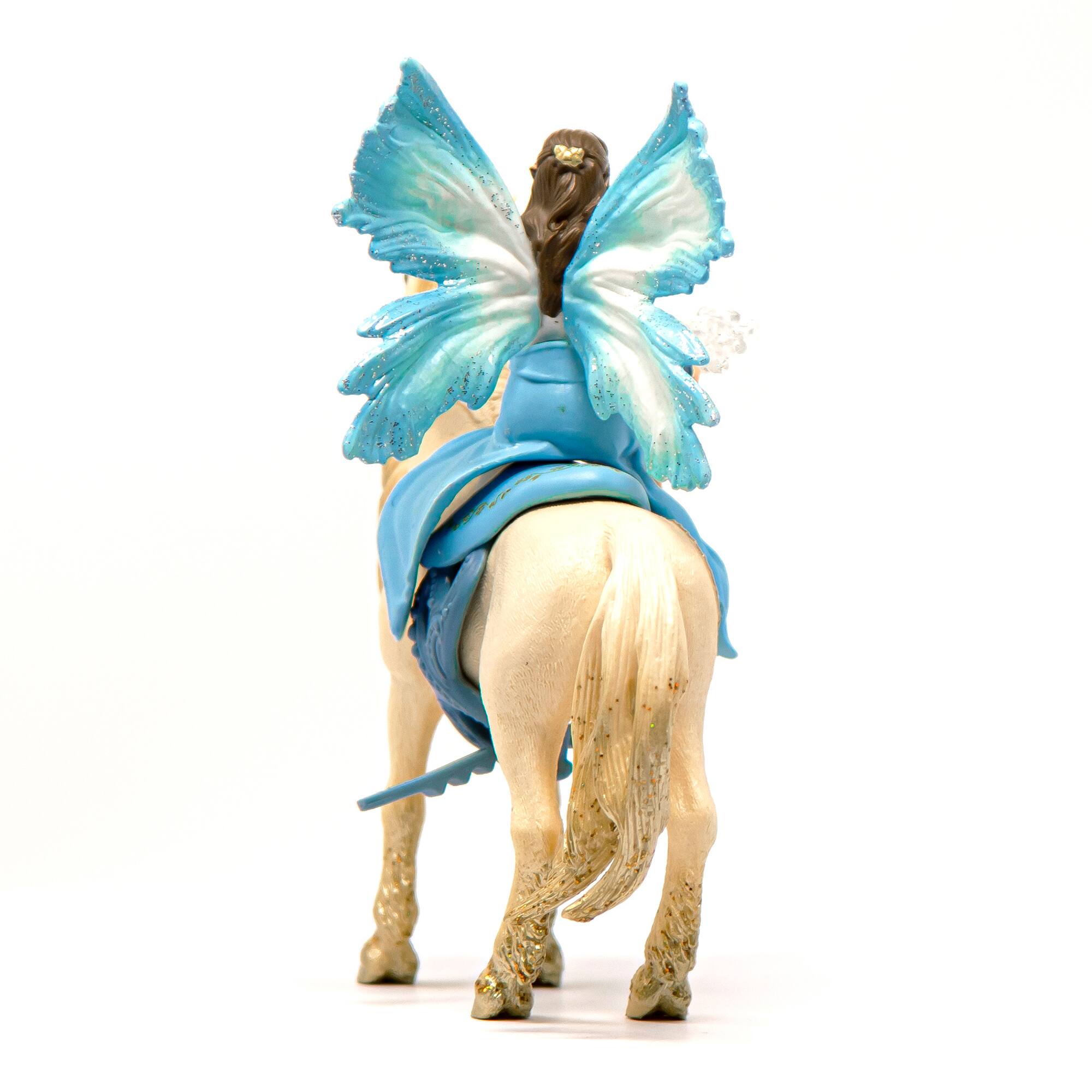 Left. Schleich - Bayala: Eyela Riding On Golden Unicorn.
