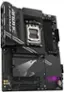 The image features a close-up of a computer motherboard, specifically an Aorus motherboard, with a purple light illuminating the area. The motherboard is designed for the AMD Ryzen processor, and it has a socket AM5. The motherboard also supports DDR4 memory, M.2 storage, and WiFi. The Aorus motherboard is part of the Team Elite series, and it is equipped with a thermal guard and an audio panel. The motherboard has a total of four fans, with two on the front and two on the back. Additionally, the motherboard has a TPM and a SYS fan.