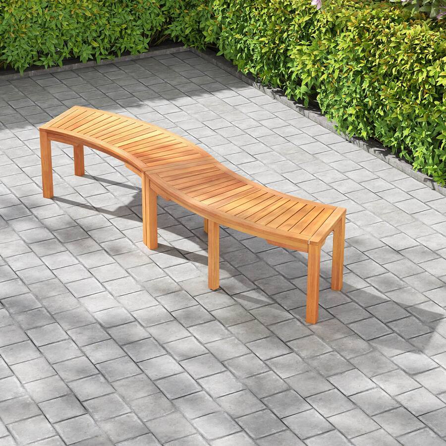 Multiple wooden benches arranged on a paved ground.
