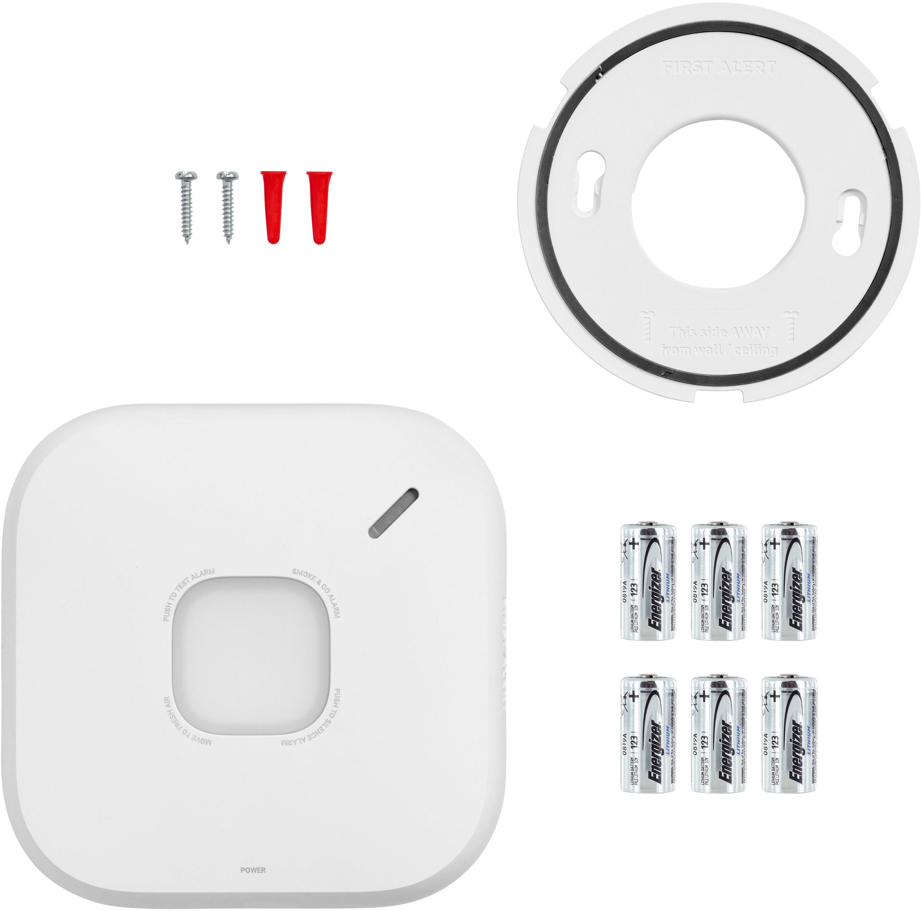 This is a smoke alarm with a battery pack and a power pack. The smoke alarm is white and has a red button. The battery pack and power pack are both white and have red accents. The packs are labeled with the Energizer brand.